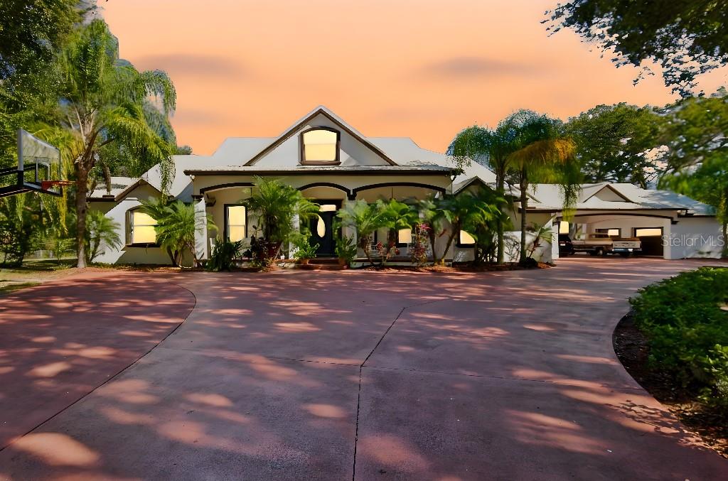 Welcome to this beautifully updated estate in Plant City, where modern upgrades meet relaxed Florida living on a spacious, private setting.  The property is located 7 minutes from all city conveniences with room to roam.  Step inside to discover new flooring throughout and a thoughtfully redesigned interior anchored by a stunning new fireplace with a stone facade, creating a warm and inviting focal point for the main living space. The updated kitchen is a showstopper, featuring quartz countertops, a classic farmhouse sink, and a clean, contemporary design perfect for both everyday living and entertaining.
This home is equipped with a whole-house generator, providing peace of mind year-round, and a solar system that adds energy efficiency and long-term savings.  Outside, you'll find new black top entry ways leading to a large concrete pad which offers ample parking and a polished approach to the property.
The backyard is a true retreat, designed for both fun and relaxation. Enjoy evenings in your new outdoor kitchen, ideal for hosting gatherings, while overlooking the screened-in pool and spa, perfectly suited for quiet nights or weekend entertaining.
With major upgrades already completed and both indoor and outdoor living spaces designed to impress, this home offers comfort, functionality, and style in a desirable Plant City location-all with no sacrifices