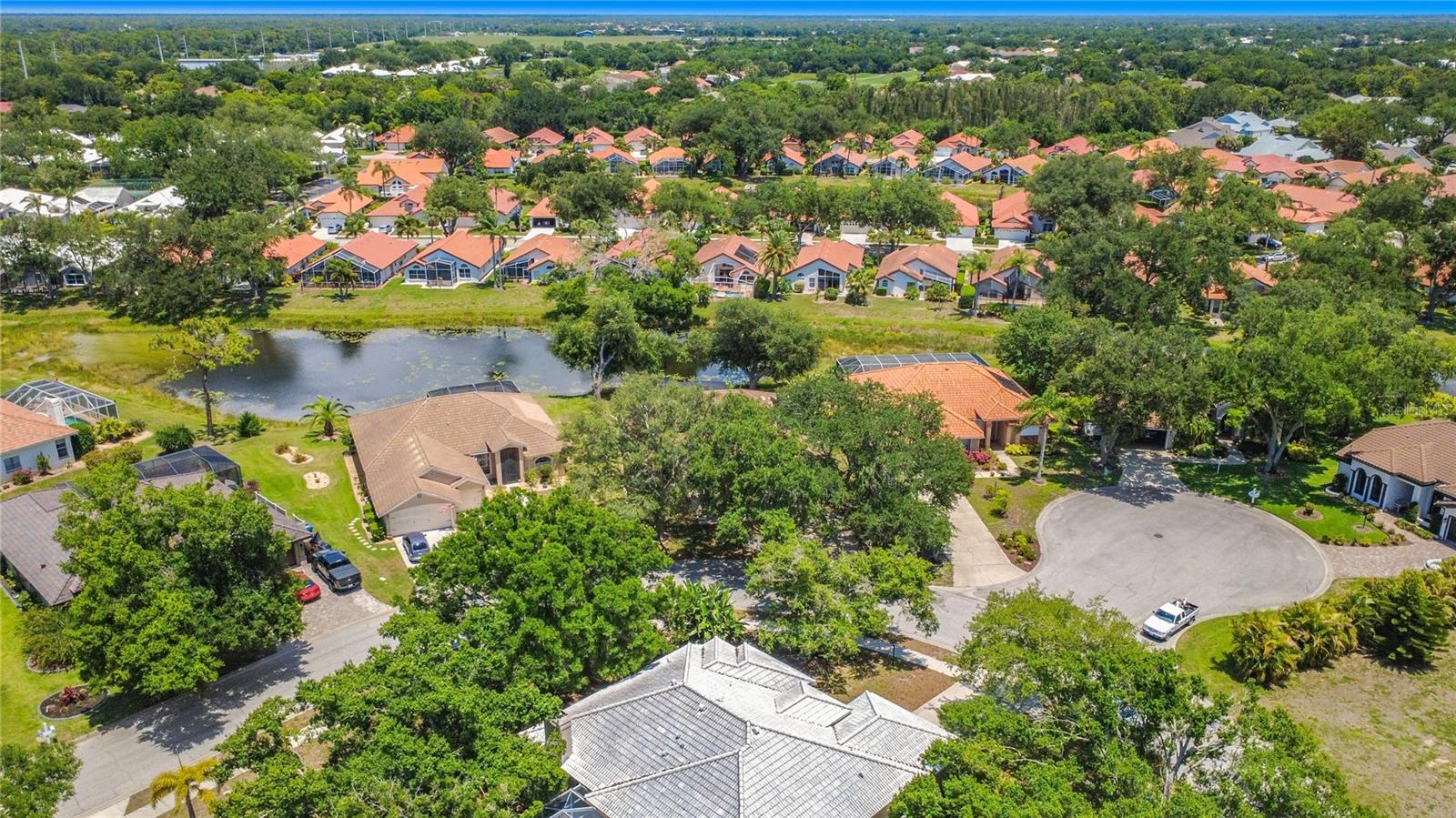 Discover exceptional waterfront living in the highly sought-after Manors of Chestnut Creek. This four-bedroom, two-and-a-half-bath pool home offers an ideal blend of spacious living areas, private outdoor spaces, and picturesque water views in one of Venice's most desirable communities.

Designed for both everyday comfort and effortless entertaining, the home features an inviting floor plan with formal living and dining rooms, complemented by a convenient wet bar area perfect for hosting family and friends. At the center of the home, the updated kitchen offers Corian countertops, a large center island, breakfast bar seating, abundant workspace, and seamless flow into the family room and casual dining area. Expansive windows and sliding glass doors frame tranquil views of the pool and lake beyond, creating a bright and welcoming atmosphere throughout.

The generously sized primary suite serves as a private retreat, featuring direct access to the screened lanai and pool area. The ensuite bath includes dual vanities, a relaxing garden tub, separate walk-in shower, and ample space to unwind. A desirable split-bedroom floor plan provides privacy for family and guests, while the flexible fourth bedroom can easily function as a home office, den, or hobby room.

Step outside to your own tropical paradise where lush landscaping, mature fruit trees, and serene water views create a peaceful setting for outdoor enjoyment. The screened lanai and sparkling pool offer the perfect backdrop for morning coffee, afternoon relaxation, or evening gatherings while overlooking the tranquil lake.

Additional features include hurricane shutters, a spacious laundry room, and an oversized two-car garage with built-in storage. Ideally located just minutes from historic downtown Venice, Gulf beaches, shopping, dining, golf courses, and recreational amenities, this exceptional property offers the very best of the Florida lifestyle. The solar panels (contract must be assumed at closing) bring your electric bill down to about $60 per month! NEW ROOF - JUST 2 YEARS OLD! 

Rarely does a waterfront pool home in Manors of Chestnut Creek become available—don't miss the opportunity to make this beautiful residence your own.
