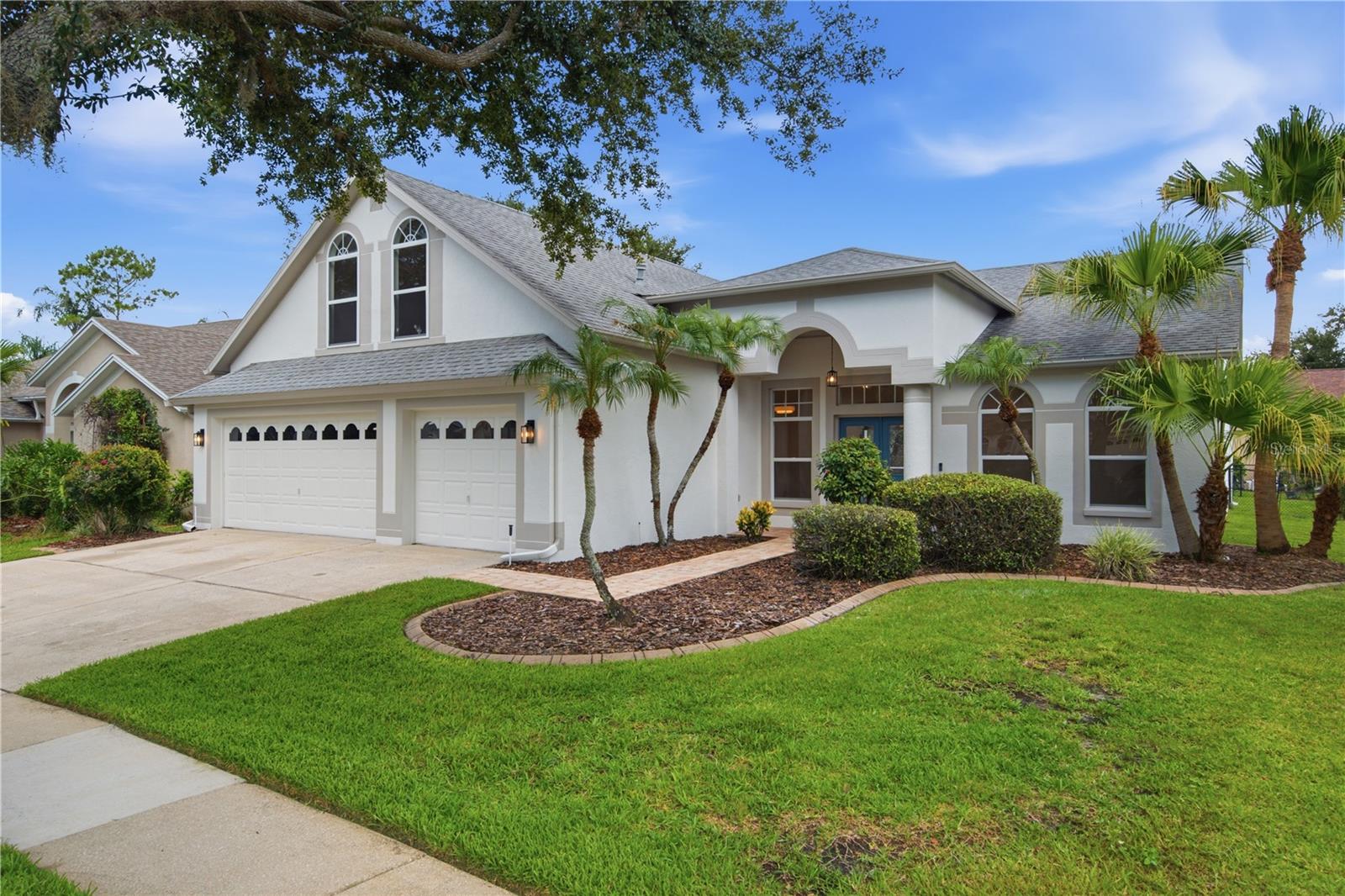 Stunning Fully Renovated 5-Bedroom Home with 3-Car Garage in Desirable Arbor Greene!

Completely renovated with exceptional attention to detail, this move-in-ready 5-bedroom, 3-bathroom home offers the perfect blend of modern luxury and everyday comfort.

The designer kitchen is the heart of the home, featuring beautiful natural oak cabinetry, elegant quartz countertops, a spacious island, and a full Samsung Bespoke stainless steel appliance package. The luxurious primary suite offers a spa-inspired bathroom with a freestanding soaking tub, oversized walk-in shower, and premium designer finishes.

Enjoy a brand-new 2026 HVAC system, luxury vinyl plank flooring throughout, beautifully renovated bathrooms, modern hardware, stylish mirrors, designer lighting, updated ceiling fans, fresh interior and exterior paint, and new smoke and carbon monoxide detectors.

Additional highlights include a 2020 roof, a spacious 3-car garage, and a large screened lanai, perfect for relaxing or entertaining year-round.

Located in the highly sought-after gated community of Arbor Greene, residents enjoy outstanding resort-style amenities, including multiple community pools, a lap pool, tennis courts, pickleball courts, playgrounds, scenic walking trails, and beautifully maintained common areas.

Every detail has been thoughtfully updated with quality craftsmanship and designer finishes—this is a truly turnkey home ready for its next owner.