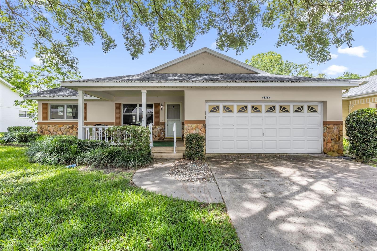 Welcome to effortless 55+ living in the heart of On Top of the World, one of Ocala’s most sought-after gated resort communities! This meticulously maintained 2-bedroom, 2-bathroom single-story home stands out as one of the largest units in the community at 1,748 square feet, offering the room and comfort most comparable homes simply can’t match. The bright, open floor plan flows seamlessly throughout, featuring brand new easy-to-maintain luxury vinyl plank flooring throughout and fresh interior paint that gives the entire home a crisp, move-in ready feel. The well-appointed kitchen offers tons of cabinet storage and plenty of counter space, perfect for everyday living and entertaining. Both bedrooms are spacious with storage closets and the two full bathrooms are thoughtfully positioned for maximum privacy. A rare and highly coveted feature, the oversized two-car attached garage keeps your vehicles protected year-round while providing valuable additional storage space that active Florida living demands. Step outside your door and enjoy world-class resort amenities including championship golf, multiple swimming pools, fitness centers, tennis, pickleball, and a packed social calendar, all within a secure and beautifully maintained gated community. This is Florida’s active 55+ lifestyle at its finest, schedule your private showing today!