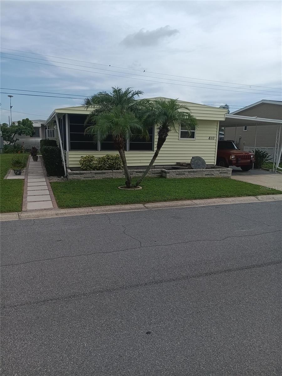 Come and see one of the most affordable “Non Age Restricted”, “Land Owned” homes in Bradenton Florida, home is newly updated and impeccably clean. You won’t have to lift a finger just bring belongings and move right in. Home is located in the Fair Lane Acres community which is Land Owned with low maintenance fee of only $134 water, sewer cost inclusive. Park has amenities featuring, swimming pool, shuffle board and pickle ball court as well as large clubhouse with many activities.Home features 2 Bedrooms, 2 bath with new tub and surround, newly remodeled kitchen with separate dining area, beautiful lania and large living room area.  Ample storage with 2 storage areas attached to a 2 car carport. All newer appliances will be included: Washer, Dryer, Refrigerator and Stove. A special feature of this home is the brick and concrete rap around sidewalk leading to front entry, then continuing to a beautifully landscaped patio with palm trees and a real Florida feel for entertaining. Great location with a multitude of shopping, restaurants, and entertainment nearby. You are only 6 miles from SRQ airport, 8 miles to beautiful beaches and Anna Maria Island, a quick 10 miles gets you to to downtown Sarasota.A convenient and affordable option for those seeking a relaxed Florida lifestyle.Schedule a visit today to see this special place.