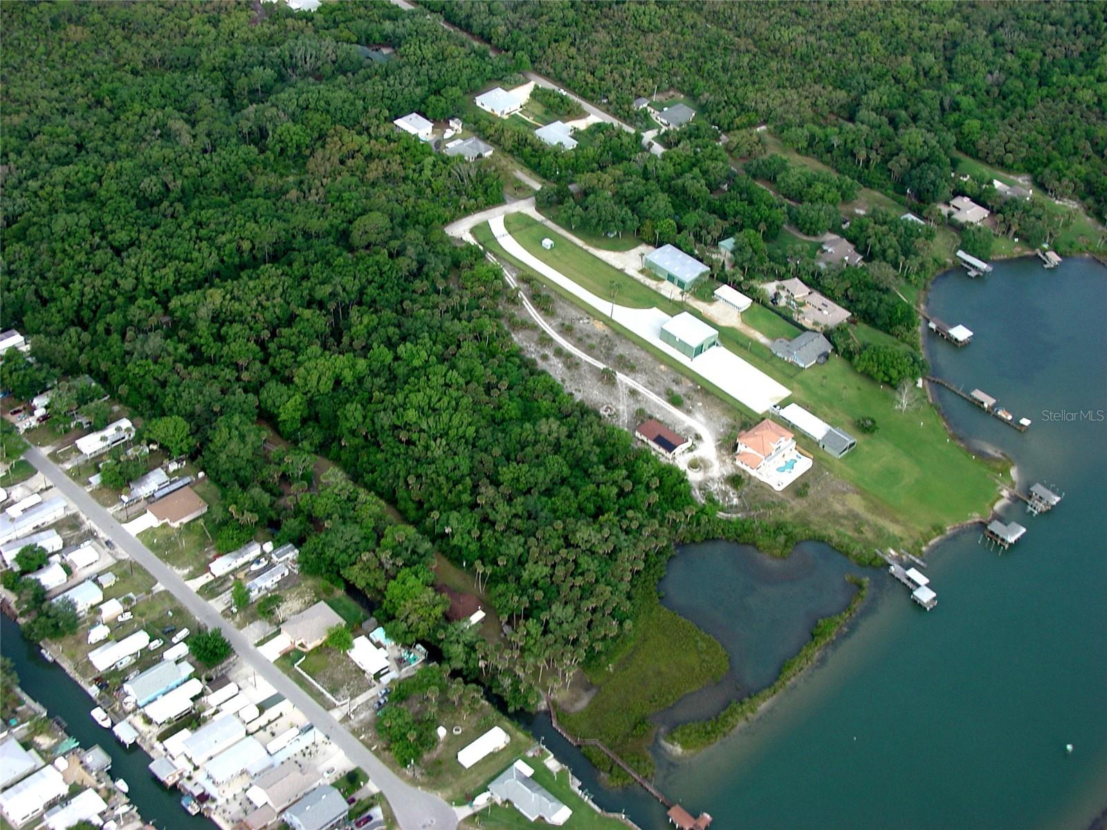Spectacular direct Intracoastal waterfront acreage comprised of 2 contiguous lots (38-18-35-08-00-0060 and 38-18-35-08-00-0070) totaling nearly 5 AC of pristine land now available. They are approximately 3.12 AC and 1.76 AC respectively and were previously approved for a three-lot subdivision based on current zoning, and in addition, Volusia County has confirmed the availability of public water to the lots.  The parcels are referred to as “No Street” only because they have remained undeveloped. The lots offer a combined water frontage of app’x 300 feet with unobstructed waterfront views, perfect for the end user seeking to create a waterfront hideaway on the River or the developer craving favorably priced riverfront acreage.  The street provides no outlet to the north or south which serves to keep the usual traffic associated with waterfront living at a minimum, yet they’re conveniently located only minutes from US-1 and I-95.