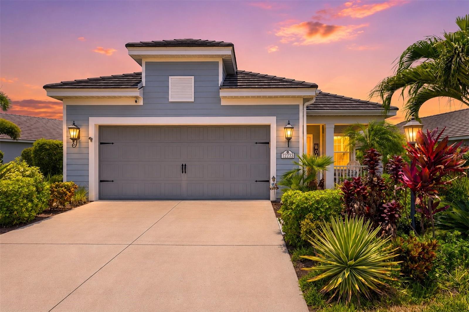 Experience the best of the Florida lifestyle in this beautifully upgraded Victory model by Neal Communities, ideally situated within the sought-after Indigo community of Lakewood Ranch. Showcasing countless upgrades and thoughtful custom touches throughout, this 3-bedroom, 2-bathroom home offers 1,766 square feet of meticulously maintained living space and a stunning saltwater pool that makes every day feel like a vacation.
Inside, you'll find an open-concept floor plan enhanced by tile flooring throughout with no carpet, tray ceilings, crown molding, plantation shutters, custom wainscoting, and abundant natural light. The beautifully appointed kitchen serves as the heart of the home and features ample cabinetry, a large granite-topped island, generous counter space, and a custom pantry door that adds both character and style. The kitchen flows seamlessly into the dining and living areas, while custom shades on the sliding glass doors provide comfort and functionality.
The spacious primary suite offers a relaxing retreat with a well-appointed bath featuring a bidet. Additional upgrades include a whole-home water filtration system, UV light installed in the HVAC system, water tank extension for improved water flow, keypad entry, overhead garage storage, and a termite control system surrounding the home.
Step outside to your private outdoor oasis and enjoy the sparkling saltwater pool and extended lanai with remote-controlled storm screens , enhanced by a premium clear-view hurricane-rated screen enclosure designed to maximize views and create an open, airy outdoor living experience. A custom front door further enhances the home's curb appeal and welcoming entrance.
Residents of Indigo enjoy resort-style amenities including a clubhouse, fitness center, pickleball courts, bocce ball, playground, resort-style pool and spa, an on-site lifestyle director, and a vibrant calendar of community events. Conveniently located near shopping, dining, golf courses, parks, and everyday conveniences, this move-in-ready home offers the perfect blend of luxury, comfort, and Florida living.
