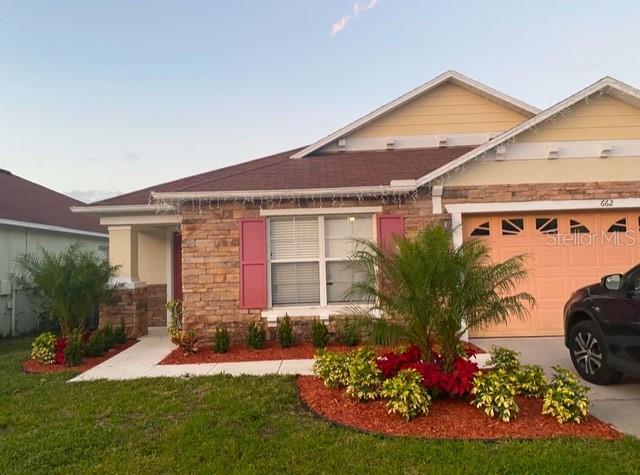 Low HOA!!! NO CDD!!! & zoned for short term or long-term rental.  New Roof 2025. Very well-maintained house located at just few minutes away from Disney!!! The house features an inviting open floor plan with an elegant gourmet kitchen, electric fireplace, customized built in stereo system throughout inside and outside, tile on all wet areas including the two living rooms and the 2 dining areas, 2024 vinyl plank flooring in all bedrooms!!! Double sink in both bathrooms with marble on countertops, granite in the kitchen, vaulted ceilings with crown moldings, ceiling fan in all rooms, stainless steel appliances from 2021, AC 16 seers from 2016, new pool pump motor and filter from 2022, new water heater 2025, water filter system, and so much more!!! Enjoy the Disney’s fireworks at the back of the house drinking a Margarita while relaxing in the heated pool!! Make your viewing appointment today!!!