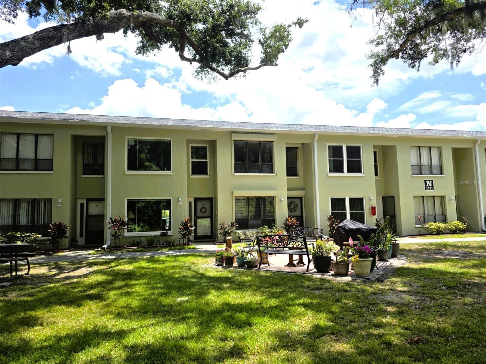 Beautifully updated/remodeled 2-Bed/2-Bath condo located in the gated nudist clothing-optional community of Paradise Lakes. This lovely light and bright home has a contemporary feel with neutral tile/laminate flooring and colors throughout. The kitchen features all new cabinets, granite counter/breakfast bar, sink, faucet, and Samsung appliances. New fixtures, ceiling fans, and electrical outlets/switches. Other updates include a new water heater, new bath vanities, faucets, and high-boy toilets, new front door & bi-fold closet doors. This open and airy condo is freshly painted and has high volume ceilings. The living room has built-in shelving/storage and a custom motorized blind. Motorized hurricane shutters front and rear for storm protection. Check out the see-through aquarium/terrarium in the upstairs loft bedroom. Combo washer/dryer unit included for convenience. The versatile floorplan features a studio lockout with a private entrance. The studio has wall-to-wall closets, a new wall air conditioner, mini-fridge, microwave, and full bath - perfect for guests or potential rental income. Enjoy outdoor living on the new brick paver patio. Buyer is responsible for verifying all information, details and dimensions. Condo association approval of Buyer is required including application, fee, background check, orientation, and membership in a recognized nudist organization. Optional membership to Paradise Lakes Resort is not included in monthly condo association fee.