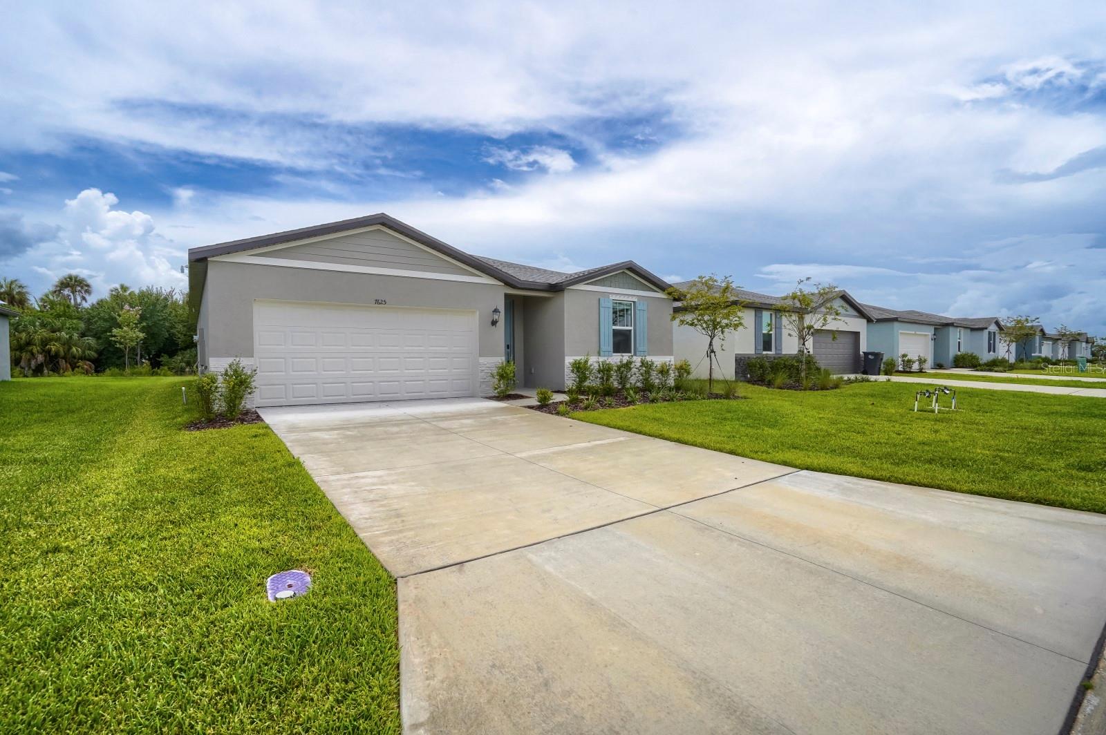 Welcome home to this beautifully designed 3-bedroom, 2-bath residence offering 1,800 square feet of comfortable living space. From the moment you step inside, you'll appreciate the bright, open floor plan that's perfect for both everyday living and entertaining. The spacious kitchen overlooks the main living and dining areas, creating the ideal gathering space for family and friends. The private owner's suite features a generous walk-in closet and en-suite bath, while two additional bedrooms provide flexibility for guests, a home office, or growing families. Enjoy Florida living from the covered lanai overlooking the backyard, with plenty of room to relax or entertain. Conveniently located in the thriving Parrish area, you'll be just minutes from shopping, dining, schools, parks, and easy access to I-75 for commuting to Tampa, St. Petersburg, Sarasota, and the Gulf beaches.