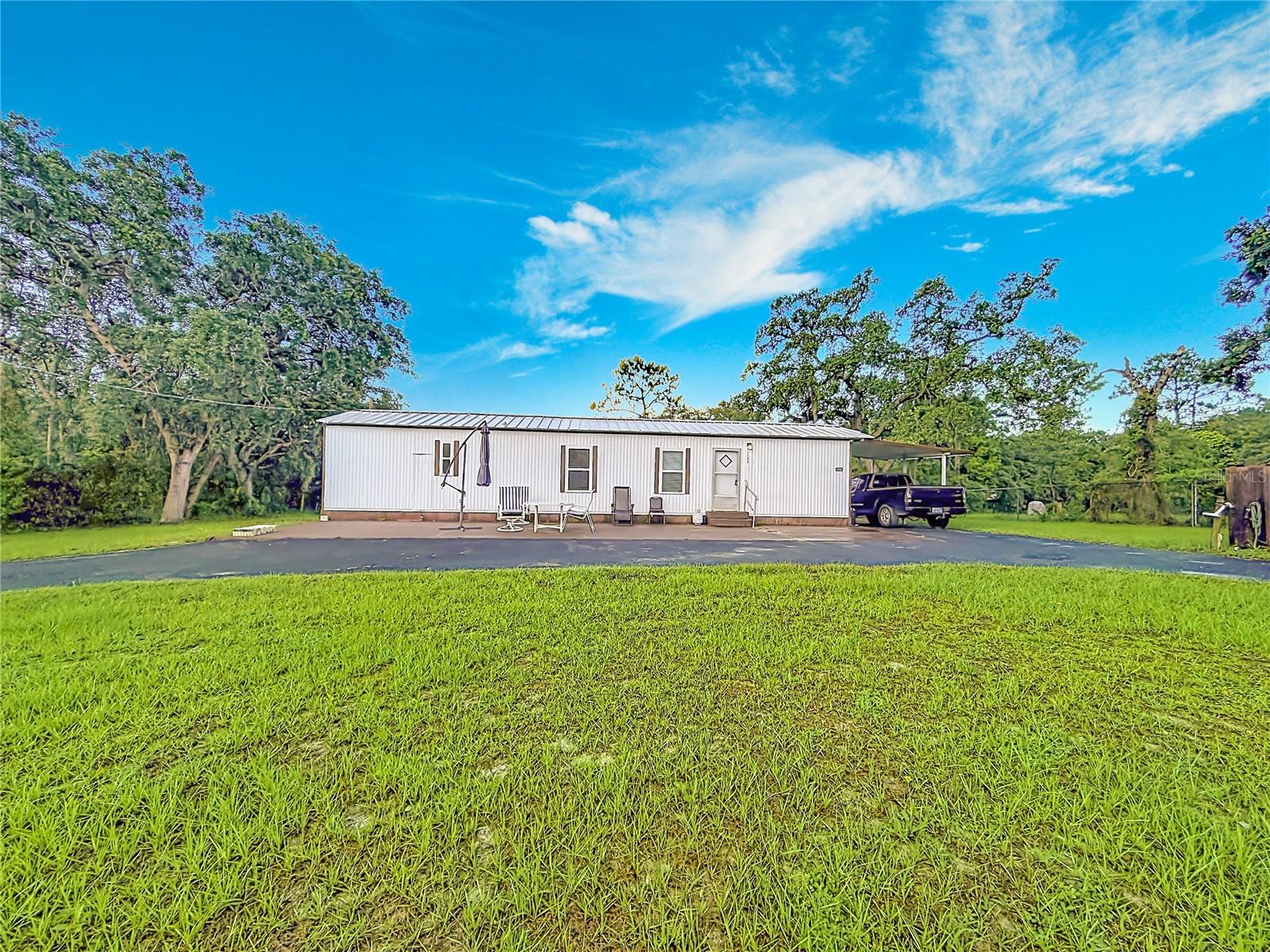 Fully furnished and move-in ready, this well-maintained 2-bedroom, 1-bath home is set on a generous .56-acre lot and offers a comfortable open-air floor plan with inviting living space. The kitchen provides ample room for cooking and meal prep, featuring granite countertops, newer appliances, and a convenient pantry. The roomy living area flows easily from the kitchen, and both bedrooms are comfortably sized for everyday living. The updated bathroom includes a newer vanity and beautifully updated tile shower. Enjoy outdoor living from the spacious covered and screened lanai, with plenty of room to relax or entertain. Additional highlights include a circular driveway, newer windows, newer AC, vinyl flooring, water filtration system, washer/dryer hookups, and a shed with electric for extra storage or workspace. This home is minutes from the famous Weeki Wachee live mermaids, Pine Island Park and Roger’s Park for fun on the water. Close to the Suncoast parkway for quick access to the airport, Tampa, Clearwater and St. Pete Beaches (Ranked in the top 5 Beaches in the US), also close to the famous Tarpon Springs Sponge Docks. Enjoy everything Tampa Bay has to offer.  Go just to the north and you’ll find Chassahowitzka National Wildlife refuge, Homosassa Springs, Crystal River and Cedar Key on the Suwannee Sound.  Beautiful gulf and river boating, terrific fishing, TOP US BEACHES, golfing, cultural entertainment, and museums...and of course beautiful year-round weather.