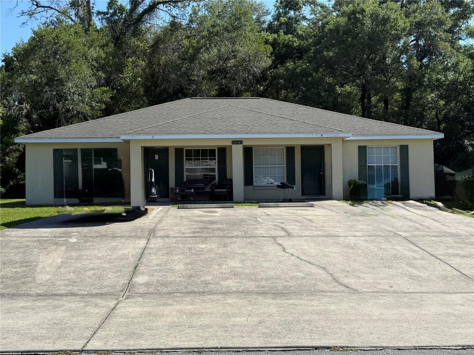 Exciting investment opportunity! This duplex features three bedrooms and two bathrooms in each unit. Both units are currently occupied, generating a gross monthly rent of $2,500. Each side has newer air conditioning, and the units include tile flooring in the kitchen, bathrooms, and living areas, with carpet in the bedrooms. Additionally, both units have inside laundry closets.