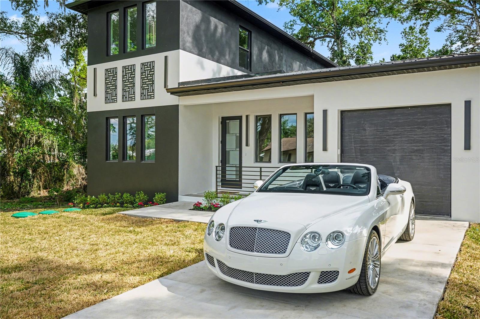 MOTIVATED SELLER!!! Welcome to one of the most exceptional modern homes in Seffner—where striking design meets superior construction.

This new construction, two-story residence offers approximately 2,098 sq ft of living space and was built with a level of quality rarely found in this market. From the bold black-and-white exterior to the clean architectural lines, this home was designed to stand out from the moment you arrive.

Inside, you’re welcomed by an open-concept layout filled with natural light, soaring ceilings, and tile flooring throughout the entire home—no carpet anywhere. The main living space flows seamlessly into a beautifully designed kitchen featuring high-end finishes, upgraded cabinetry, designer hardware, and a sleek modern aesthetic, ideal for entertaining and everyday living.

What truly sets this home apart is how it was built. Constructed with concrete block on both floors, upgraded with foam insulation, and equipped with a durable metal roof along with hurricane impact windows and doors, this home delivers exceptional durability, energy efficiency, and peace of mind—well beyond typical new construction.

Step outside and enjoy epoxy-coated front and rear porches, creating clean, modern, and low-maintenance outdoor living spaces. The property also features lush St. Augustine grass with a full irrigation system, providing instant curb appeal and ease of upkeep.

Designed for today’s lifestyle, the home is pre-wired for security cameras and surround sound, allowing for a seamless technology setup. The oversized garage adds valuable flexibility for storage, workspace, or additional functionality.

Enjoy the added benefit of a private well and septic system—eliminating monthly water and sewer bills while offering long-term efficiency.

Conveniently located near Tampa, Brandon, I-4, and I-75, this home offers both accessibility and a level of design and construction that is truly uncommon for the area.

Modern design. Fortified construction. Premium finishes. The garage, front and rear porches will be epoxied. Property will be given a professional final cleaning before closing.