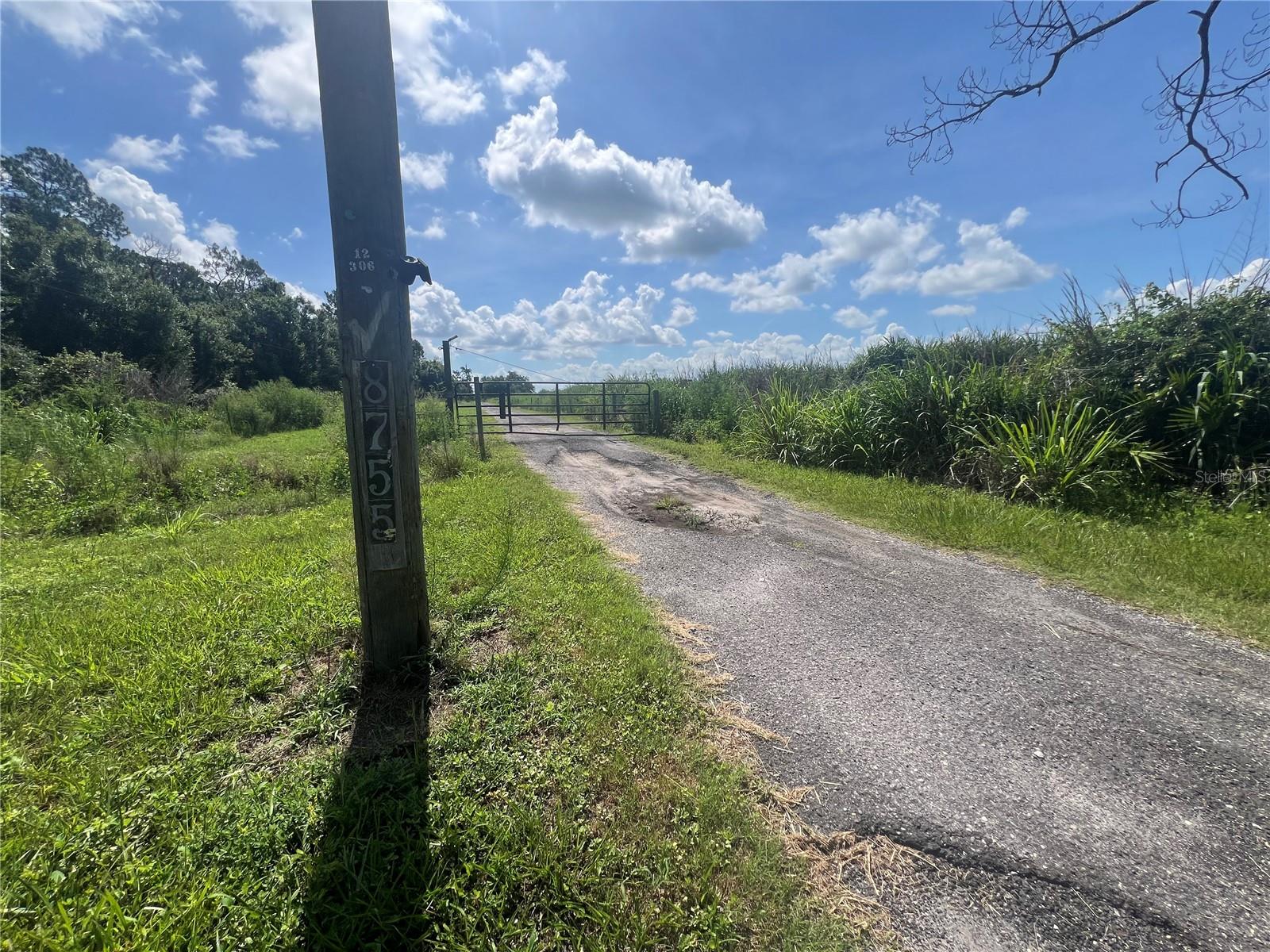20 acres with approximately 15+ acres of barbed wire perimeter fencing and some cross fencing.  Balance of property is low and or wetlands. There is a 3 bedroom 2 bath home on the property in need of rehabbing along with other structures also in need of repairs. Seller states well is approximately 400 feet deep with water filtration system at the home.  Water is piped to several areas on the property. Septic system in place. This property would make a great family compound, pasture land, equestrian center, event center, to name a few.