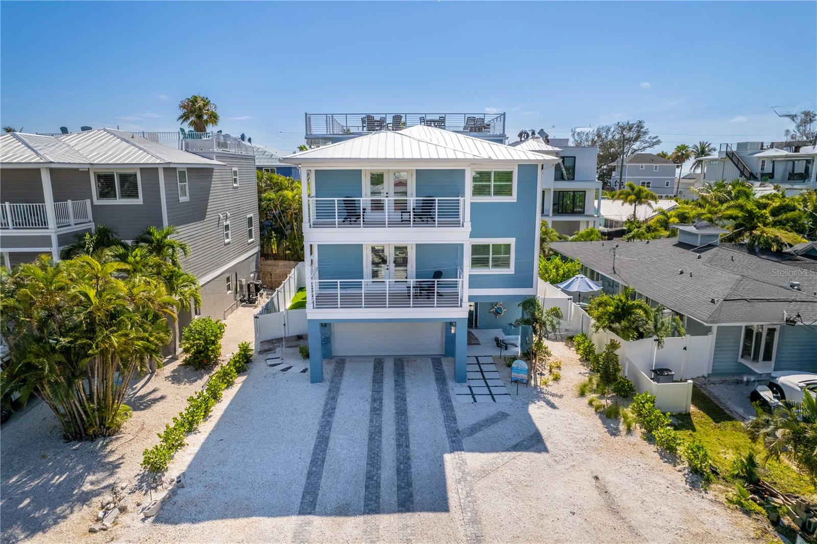 HUGE $495K PRICE REDUCTION  CURRENTLY $200K IN RENTALS ON THE BOOKS FOR 2025 

Introducing "Endless Summer"—your perfect vacation retreat and investment opportunity! This newly constructed (2024) gem features 7 spacious bedrooms and 6 elegant bathrooms, just a 4-minute stroll from the beach.


Key Features:
Bedrooms: 7
Bathrooms: 6
Elevator: Easy access across all levels
Pool & Spa: Walk-in pool and spa for ultimate relaxation
EV Charger: Eco-friendly convenience
Designer Touches: Stylish accent walls throughout
Rooftop Deck: Perfect for Coastal Sunsets
Backyard Oasis: Featuring turf for putting, cornhole, and Connect Four. Enjoy the walk-in pool and spa. The garage includes a ping pong table, extra refrigerator, and ice maker.

"Endless Summer" is designed for relaxation and enjoyment, with a projected income of around $380K, making it a fantastic investment. Experience the magic of Bradenton Beach at "Endless Summer" and create lasting memories. The sales agent is a part owner of this property.