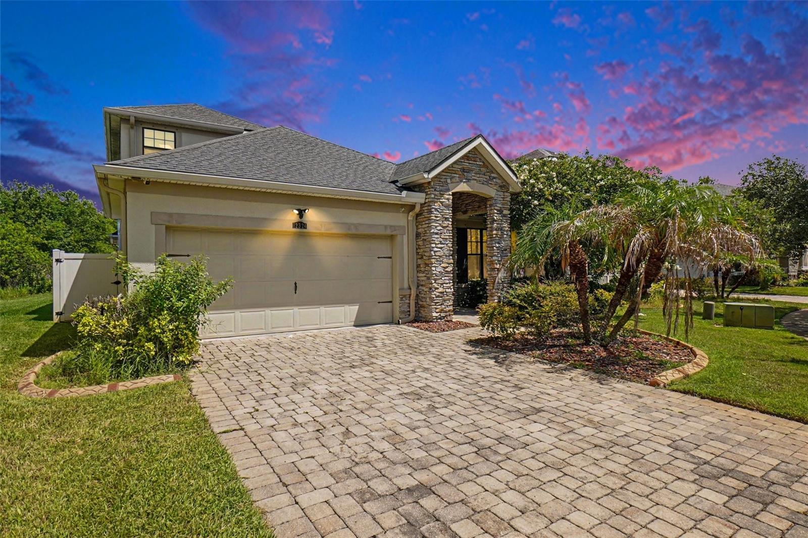 Welcome to 12324 Streambed Drive, a beautifully maintained Mattamy-built home in the highly sought-after Triple Creek community of Riverview. Tucked away on a quiet cul-de-sac with no direct front neighbors and peaceful conservation views behind, this move-in-ready home offers the perfect blend of privacy, comfort, and modern style. Inside, you'll love the open-concept layout featuring COREtec luxury vinyl plank flooring, fresh interior paint, and no carpet throughout the main living areas. The kitchen is equipped with 42-inch mocha cabinets, granite countertops, stainless steel appliances, a large island, and a walk-in pantry, making it perfect for everyday living and entertaining. The spacious primary suite offers dual closets, dual vanities, a garden tub, and an oversized walk-in shower. Two additional bedrooms are located on the main floor, while the upstairs features approximately 700 square feet of finished living space with its own A/C, a fourth bedroom, full bath, walk-in closet, and climate-controlled storage—ideal for guests, a home office, or a bonus room. Additional upgrades include a new water heater, 1.5-year-old upstairs A/C, professionally maintained roof, hurricane shutters, Samsung washer and dryer, paver driveway, and beautiful landscaping. Conveniently located near shopping, dining, major employers, and a new elementary school within the community, this home is ready for its next owner.
