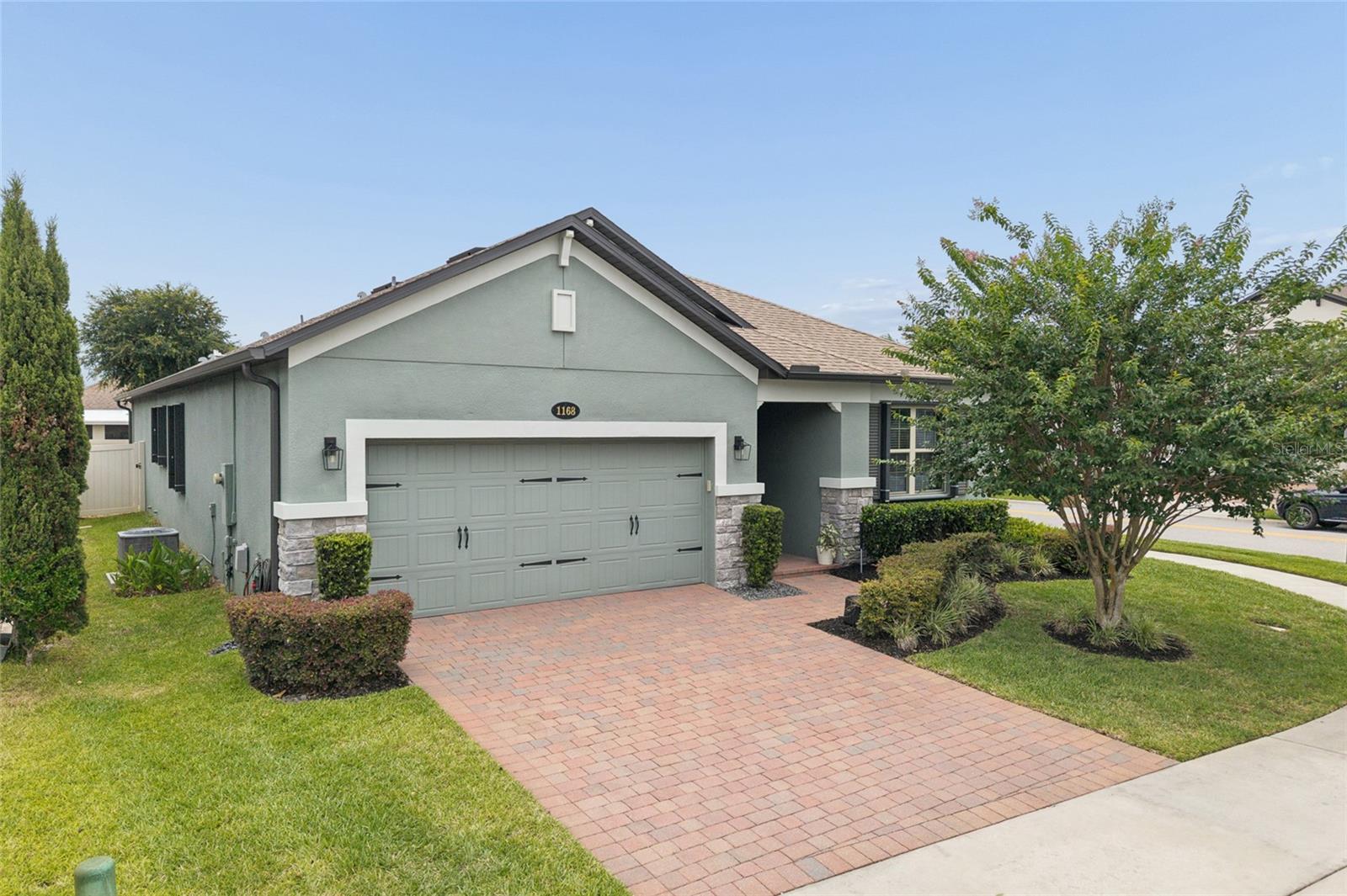 Welcome to this beautifully upgraded residence built in 2019 by M/I Homes, located in the highly desirable and intimate community of Narcoossee Del Sol, featuring only approximately 95 homes. This exceptional Madeira II model offers 4 bedrooms and 3 bathrooms and combines modern design, energy efficiency, and luxury upgrades throughout, delivering the perfect blend of comfort, style, and functionality. Step inside and experience a thoughtfully designed open floor plan with elegant porcelain tile flooring throughout, upgraded cabinetry, and high-end appliances. The kitchen and bathrooms have been tastefully enhanced, including quartz countertops, floor-to-ceiling tile in all bathrooms, and luxurious primary suite featuring a spa-style shower with body jets.This home is fully equipped with premium upgrades, including: Whole house water filtration and water softener system. Under-sink reverse osmosis drinking water system provides purified, great tasting water for drinking and cooking, adding convenience and enhanced water quality for everyday use. Central vacuum system. Smart thermostat and keyless entry. The A/C system enhanced with two UV sterilization lights to help improve indoor air quality and reduce microbial growth. Professionally maintained A/C system (serviced twice a year since installation) Hurricane shutters for all windows and patio doors. Overhead storage racks in the garage. Laundry room with utility sink and built-in cabinets The outdoor living space is equally impressive. The backyard has been thoughtfully designed with pavers, artificial turf, and a private putting green, creating a perfect area for relaxation and entertainment. A double-door fenced enclosure provides privacy and convenience, while the irrigation system maintains the lush landscaping. Additionally, raised garden beds and a productive vegetable garden add charm and  functionality to the outdoor space. Also, equipped with gutters to help protect the home's foundation. Situated on a desirable corner lot with a tranquil water view, this home offers both privacy and scenic beauty. The community features low HOA fees and no CDD. Located just minutes from Lake Nona, Medical City, Veterans Affairs facilities, shopping centers, dining, and major highways, this home offers unmatched convenience in one of Central Florida’s fastest-growing and most desirable areas. Future development plans include a nearby K-8 public charter school, further enhancing long-term value and desirability of the neighborhood.This is a rare opportunity to own a highly upgraded, move-in-ready home in a rapidly appreciating location. Pride of ownership is evident throughout. This home has been meticulously maintained and thoughtfully upgraded beyond builder standards. Buyers will appreciate the quality, attention to detail, and extensive improvements that are rarely found, even in new construction. You will not be disappointed when touring this exceptional property. Schedule your private showing today!