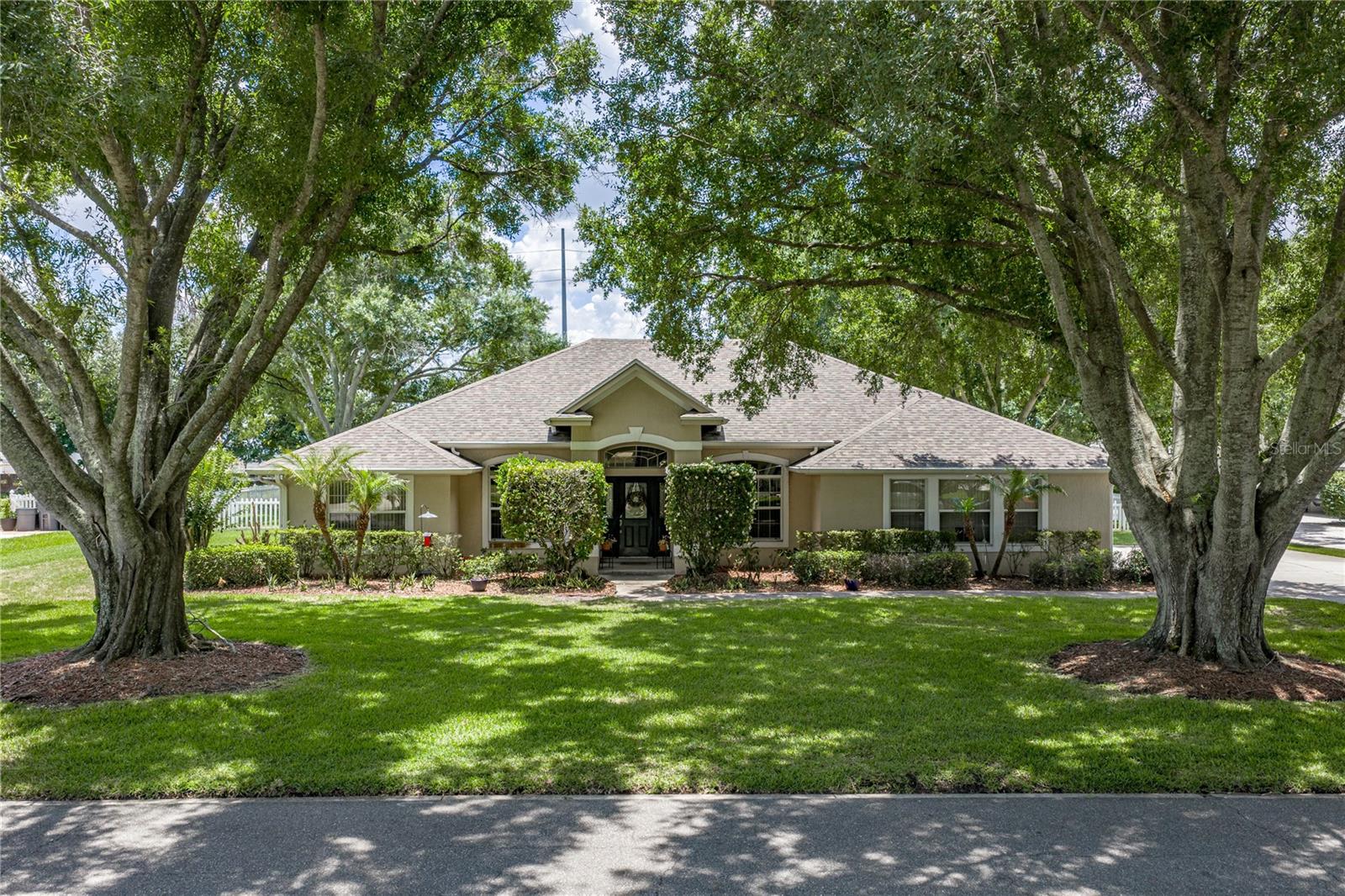 Don't miss out on this very rare opportunity to secure a home in the prestigious Eloise Pointe Estates, as homes in this gated subdivision rarely come on the market. This split-bedroom, open-plan POOL home is on an oversized lot and features 4 bedrooms, a den, and 2 baths. Upon arrival, the twin large oak trees that dominate the front yard serve to bracket the home. The mature landscaping is irrigated by an automatic system fed by a well, a real money saver. The side-load double garage is at the end of a wide driveway with a parking pad. The covered front entry leads to a front door with a leaded-glass insert. Once inside, the welcoming foyer receives additional natural light from the leaded-glass sidelights and the over-the-transom window. The dining room access from the foyer is defined by beautiful architectural arches and pass-through openings. The dining room gets great ambient light from the large arched double window at the front of the home. On the opposite side of the foyer, near the front door, is the home office/den. The den's double doors are a welcome feature when privacy is desired. The den also has a double arched window, adding symmetry to the front of the home, and a ceiling fan. The foyer opens into the great room via an arch. The great room has a quadriple slider that opens to the covered lanai and pool area, a ceiling fan, and crown molding. Adjacent to the great room is the chef's delight kitchen with its stainless steel appliances, ample cabinetry and counter space, handy snack bar, and walk-in pantry. The dining room is easily accessed from the kitchen through another archway. Next to the kitchen is the dinette. The architectural glass in the dinette gives great visibility to the pool and backyard. Just off the kitchen is the west wing and the short hallway that leads to the primary bedroom suite. The huge primary bedroom has a raised tray ceiling, a ceiling fan with light, and is at the rear of the home. The primary suite has a large walk-in closet and a primary bath with a linen closet, dual vanities, a private toilet area, a stall shower with a glass door, and a corner jetted tub. Also behind the kitchen is the indoor laundry room, which doubles as the mudroom for the attached two-car garage. The washer and dryer stay with the new owners. The entire east wing holds the 3 other bedrooms. Bedrooms 2 and 3 have ceiling fans and walk-in closets. Bedroom 4 is at the front of the home and has a ceiling fan and a reach-in closet. The hall connecting all 3 bedrooms houses the guest bath with a combined tub and shower. There are many architectural touches throughout that increase the "coolness" of this home. Special woodwork, a creche, crown molding, and built-in features abound. The covered lanai area has 2 ceiling fans. The 16x32 pool sits inside a large birdcage area and has a safety fence and attachments for pool volleyball. The pool has a "V"- shaped bottom and easy-access steps and railings at both ends. The backyard has a vinyl fence, perfect for the family's furry member. The home also has 35 solar panels, which greatly impacts the electric bill. Of special importance is that the roof was replaced in 2020, the water heater in 2022, and the AC in 2024. Don't miss out on the chance to move into the highly desirable Eloise Pointe Estate.