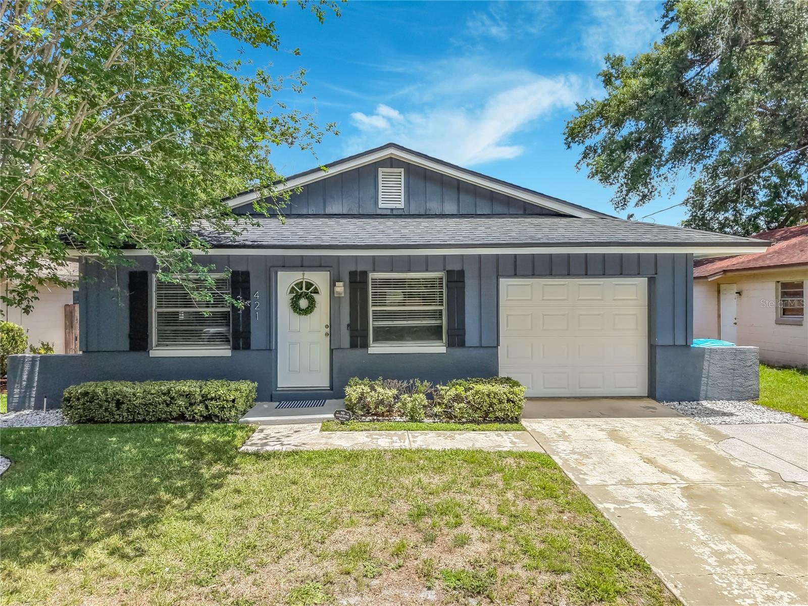 From modern finishes to classic comfort, this move-in-ready 3-bedroom, 2-bathroom Longwood gem has it all. Inside, the beautifully updated kitchen shines with granite countertops and stainless steel appliances, while both bathrooms have been thoughtfully refreshed. Enjoy ultimate peace of mind with major structural updates, including a brand-new AC installed in 2024 and roof replaced in 2022. An exceptional highlight of the property is the climate-controlled, multi-purpose bonus suite. Equipped with its own dedicated cooling system, this versatile space offers endless possibilities; it is currently curated as the ultimate game-day lounge, but easily adapts into a quiet executive home office, a private fitness sanctuary, or an inspiring creative studio for art and music. Step outside to find an oversized, fully fenced backyard—the perfect oasis for your pets to roam freely— as well as enhanced landscaping that provides incredible curb appeal. Perfectly positioned just moments from shopping, dining, the SunRail station, and the vibrant weekly farmer's market, this home blends contemporary charm with ultimate convenience!