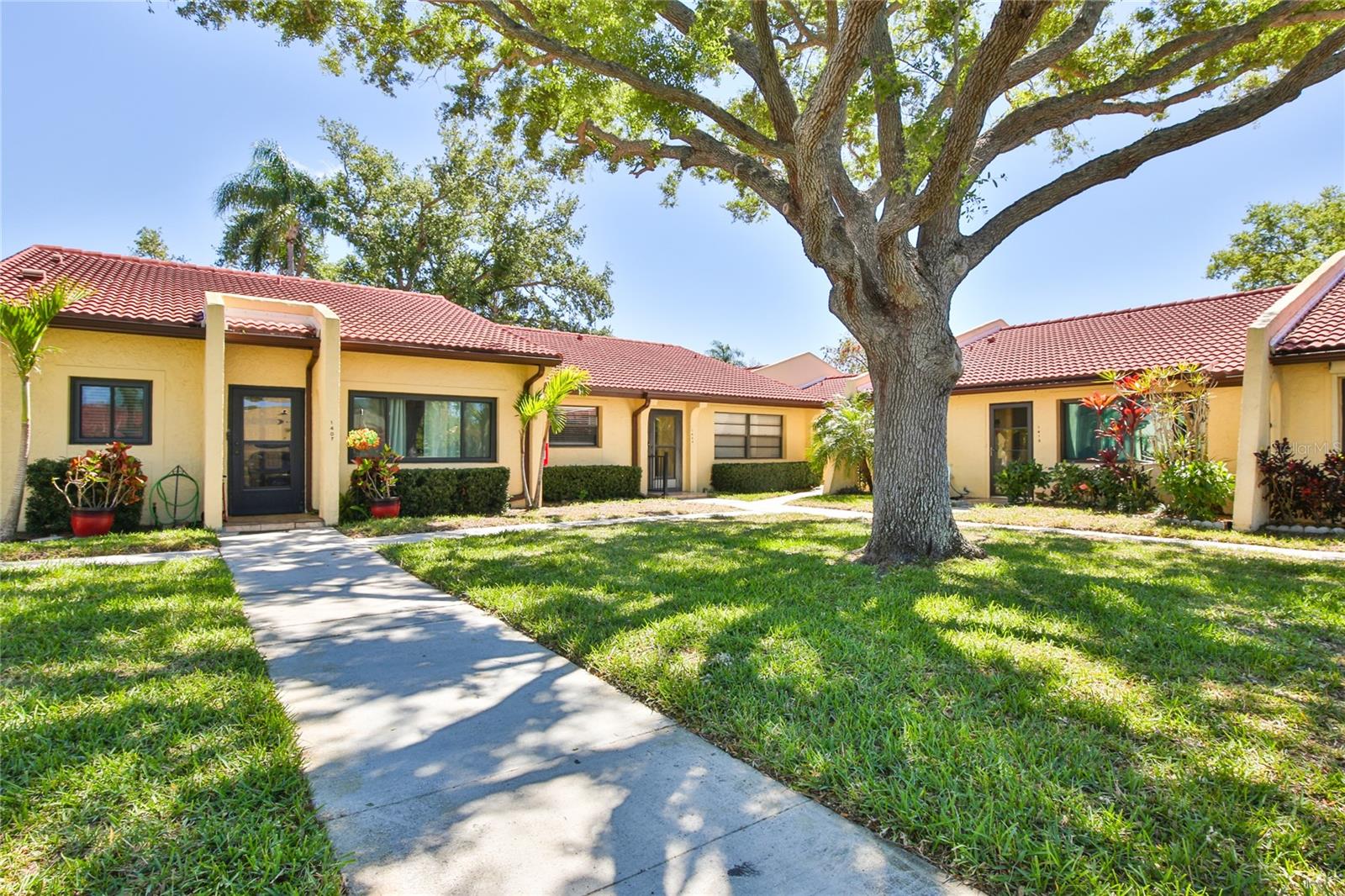 Welcome to Meadowcroft - a hidden gem in Bradenton.  This neighborhood has become a very popular selection for condo buyers given the ideal location, excellent amenities and management.  This particular unit boasts some of the most tastefully designed renovations in the entire community.   Spacious floor plan with high ceilings.  New tile roofing (2024) to put your mind at ease.  Condo needs zero work - everything has been done.  Ready to move in and enjoy.  Renovations include updated kitchen (2024) including a brand new dishwasher (2025).  Fully renovated and modernized bathrooms (2024), beautiful dark wood flooring consistent throughout condo (except for bathrooms which has new tile).  Professionally removed all "popcorn" ceilings.  Stacked laundry units.  Location wise: enjoy GT Bray park - it is 2 minutes away and is perfect park for baseball, running, dogs, picnics, and more.  Anna Marie Island beach is a short 8 minute drive.  Hospital is also very close, only a couple minutes drive.  Plenty of shopping on Cortez and Manatee including Target, Walmart, Publix, Home Depot, and many excellent restaurants all within a very short distance.  Close proximity to downtown Bradenton as well (10 minutes).  Pictures don't do it justice, so come and see in person before this one gets scooped up.