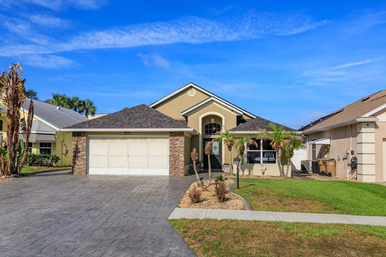 Finally, a 3-Bedroom POOL home with 2-Bath PLUS OFFICE (flex space) with NO REAR NEIGHBORS in the highly prized community of Citrus Highlands! This quality-built block home has been maintained by its ORIGINAL OWNER (so the building plans are available for review).  You will find this perfect one-story home has a WIDENED STAMPED DRIVEWAY to fit your EXTRA vehicles or those of your guests.  The street has a cul-de-sac at the end, so no through traffic or buses.  The Kitchen has a BREAKFAST BAR and is OPEN to the Dinette area which opens to the OUTSIDE KITCHEN.  The GREAT ROOM is expansive and is OPEN to the Dining Room area and has a 3-panel slider to the covered porch. Bedroom #2 will fit a queen and Bedroom #3 WILL FIT A KING BED.  Improvements include:   Screened-in Gunite POOL with JETS!  COVERED PORCH accoutered with OUTSIDE KITCHEN and seating area!   NEW ROOF in 2023!  AC + splitter in 2023!  Cabinets in the LAUNDRY ROOM.  Wood style LVP in Living and Bedrooms. BATH #2 completely RENOVATED. Sky-reaching LANAI SCREEN is vaulted to align with the rooftop.  Fabulous OUTSIDE KITCHEN!  Flooring in ATTIC!  FLEX SPACE is now used as a playroom but it could be an OFFICE or GAMING ROOM.  VINYL FENCING has REINFORCED CEMENT FOUNDATION!  NEW FAN FIXTURES!  HARDWIRED SECURITY SYSTEM.  WORKSHOP IN INSULATED GARAGE. NEW FIXTURES/SINK IN PRIMARY.  NEW GARBAGE DISPOSAL 2026!   BEST THING ABOUT THIS HOUSE:   the AMAZING POOL AND LANAI measuring 23' x 42'!!  Electric is available to the pool.  The foundation surrounds the pool and REINFORCES THE POSTS along the fence.  The 1-1/2 car garage is extra-long at 22' and has a workshop, a sliding screen, egress to the side property and accesses the laundry room inside the home!    HOA is inexpensive and features a community pool for Phase 1 residents ONLY! This community is close to Disney and all the attractions. NO SHORT-TERM RENTALS IN CITRUS HIGHLANDS PHASE 1!! Visit Citrus Highlands, own in Citrus Highlands and enjoy the lifestyle!
