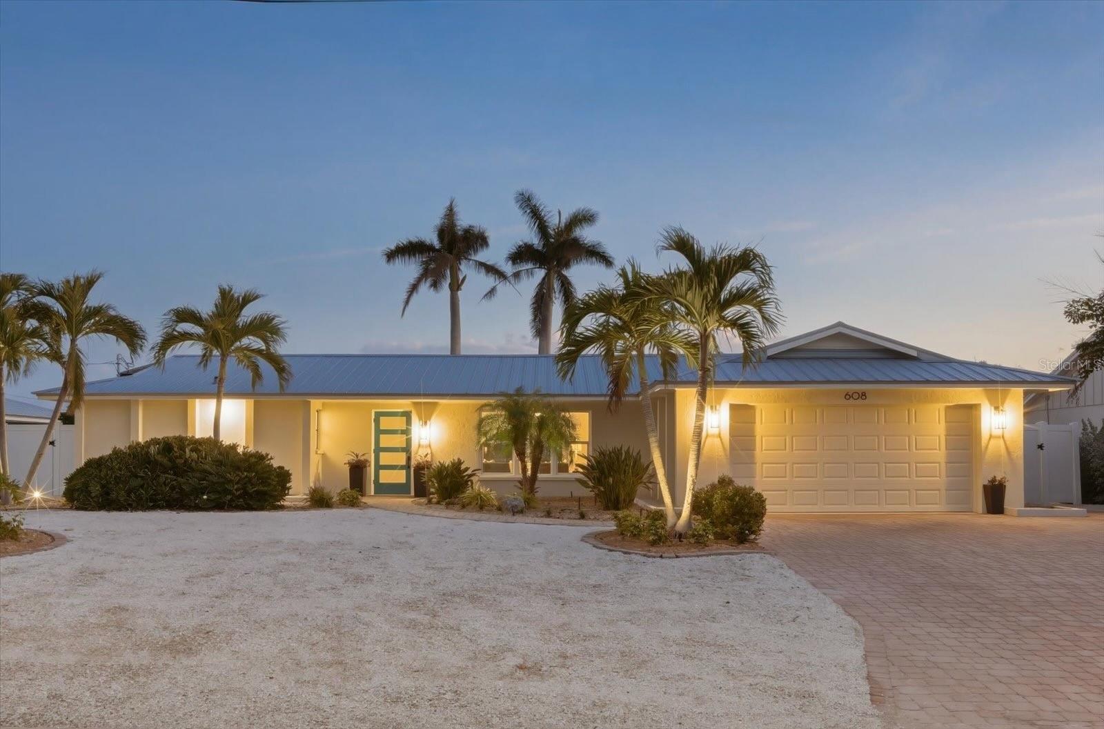 Tucked within the exclusive waterfront community of Key Royale on Anna Maria Island, this beautifully renovated canal-front residence offers an exceptional blend of island charm, privacy, and effortless island living. Designed to embrace the Florida lifestyle, the home is centered around a spectacular pool courtyard, where almost every room opens to the expansive outdoor living space, creating a seamless connection between indoors and out.

Bathed in natural light due to its desirable southern exposure, the home invites sun-filled days by the pool and tranquil evenings under the coastal sky. The thoughtfully designed split floor plan features a private primary suite with ensuite bath, along with two additional guest bedrooms and a well-appointed second bathroom, offering comfort and flexibility for family and visiting guests. The home offers a new roof and seawall was replaced in 2006, ensuring lasting quality and peace of mind for years to come.

Ideally situated on a deep-water canal, the property provides a 10,000 lb boat lift and dock with water and electric. Direct access to Tampa Bay, the Gulf of Mexico, and the Intracoastal Waterway, make it a dream for boating enthusiasts and lovers of life on the water. Also, located just moments from Anna Maria Island’s world-renowned beaches, charming boutiques, and acclaimed dining, this residence captures the essence of luxury coastal living in one of the island’s most coveted neighborhoods. Don't miss this extraordinary opportunity to experience the elegance, serenity, and waterfront lifestyle that make Key Royale truly exceptional.