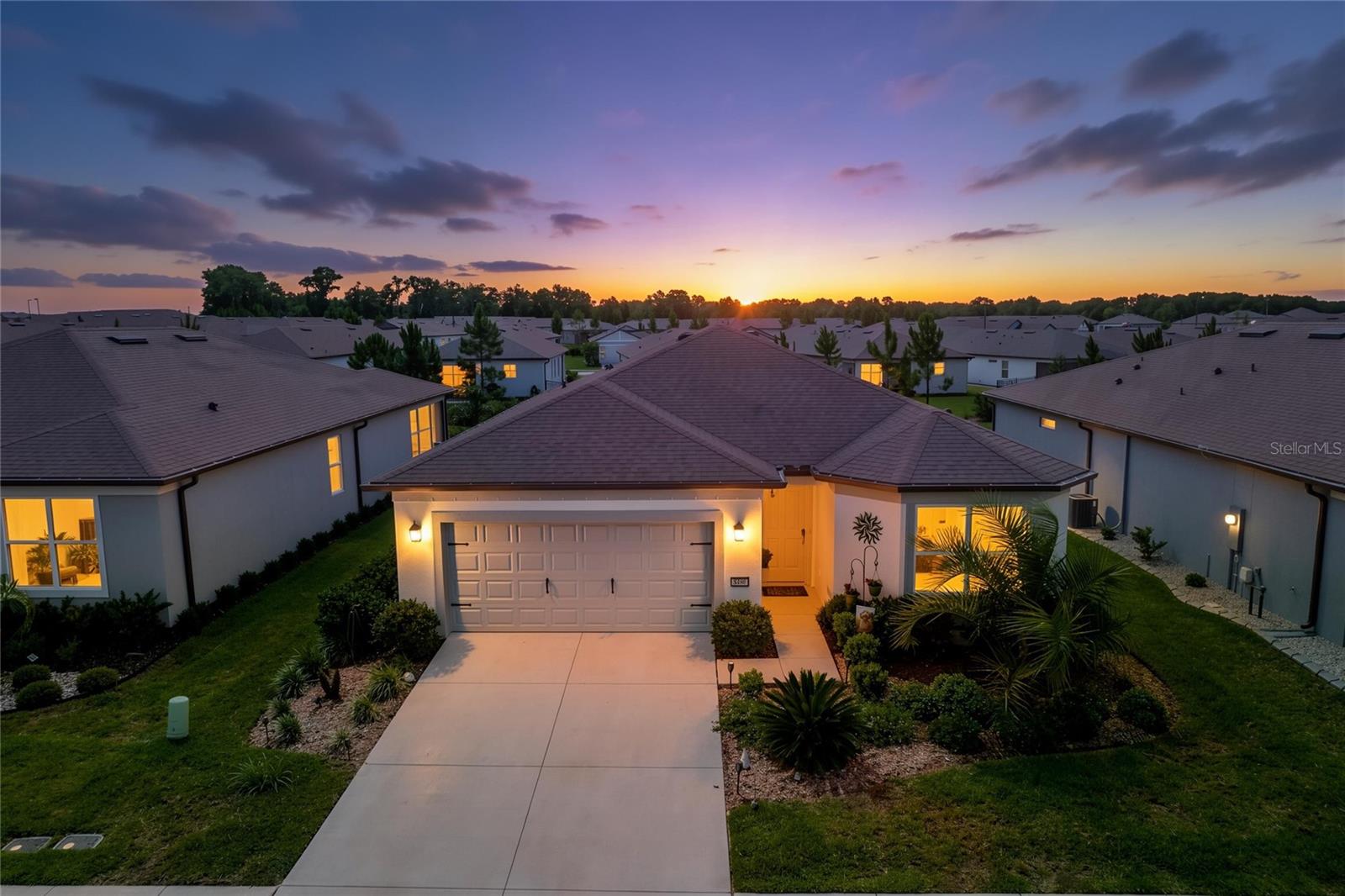 Welcome to this beautifully upgraded Cresswind model in the highly sought-after Del Webb Stone Creek community. Featuring 3 bedrooms, 2 bathrooms, and a thoughtfully designed open-concept layout, this light-filled home offers the perfect blend of modern comfort, elegant style, and effortless low-maintenance living.  

From the moment you enter, you’ll appreciate the high-end ceiling fans and designer lighting throughout the home, adding both elegance and everyday functionality. The main living areas feature luxury vinyl flooring, creating a seamless and modern flow. Cooking enthusiasts will appreciate the thoughtfully designed kitchen, featuring white soft-close shaker cabinetry, stainless steel appliances, abundant storage, and generous counter space for daily living. The open layout creates an inviting atmosphere for gathering with family and friends while cooking and entertaining. 

The spacious primary suite provides a relaxing retreat with a walk-in shower featuring a premium glass enclosure, dual vanities, and a well-appointed layout designed for comfort. Two additional bedrooms offer flexibility for guests, a home office, or hobbies.

Step outside to the screened lanai, perfect for enjoying Florida mornings or quiet evenings in a private, peaceful setting. The extended garage is a standout feature, offering ample space for two vehicles plus a golf cart, boat, or additional storage, and includes a built-in workbench and durable Shark Coating floor for a clean, polished finish.

Residents of Del Webb Stone Creek enjoy an exceptional resort-style lifestyle with access to world-class amenities, including the Reflection Bay Golf Club, indoor and outdoor resort-style pools, a state-of-the-art fitness center with sauna and indoor walking track, tennis, pickleball, and bocce courts, miles of walking and biking trails, a full-service spa, and a vibrant clubhouse featuring a wide variety of social clubs and activities. Conveniently located near shopping, dining, medical facilities, and everything Ocala has to offer, this home delivers the perfect blend of luxury living and an active adult lifestyle.