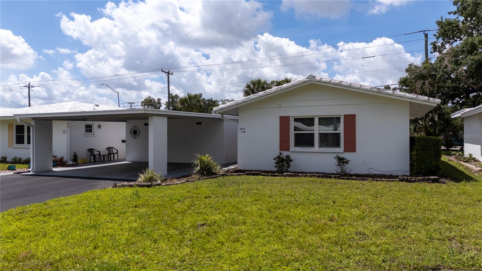 Welcome to your next home in sunny Sarasota! This well maintained villa in the lovely Strathmore Villa community offers both comfort and convenience. It also comes fully furnished!! This is an active 55+ community, where at least one resident must be 55 or older, and offers a peaceful setting with great amenities including a clubhouse and community pool. Right away, you'll notice the spacious carport with room for up to 3 vehicles - something you don't always find, and perfect for both residents and visitors. Step inside to a bright and welcoming living area with plenty of room to relax or entertain, making it easy to feel right at home! The layout flows nicely, giving you flexibility to make it your own.  Just off the living space, you'll find the kitchen and dining area - practical, functional, and ready for everyday living or hosting friends and family. This home features two generously sized bedrooms, including a primary suite with its own private bathroom. Both rooms offer comfortable space, natural light, and versatility. With two full bathrooms, convenience is built right in - ideal for families, guests, or even a home office setup. Open the sliding glass doors leading into your private patio area - a great spot for morning coffee or relaxing evenings. Right outside the unit, you'll also find a dedicated storage building currently used as a laundry room, adding extra functionality and keeping everything easily accessible while maximizing your interior space. The location is hard to beat! You're just a short drive from shopping, dining, the UTC Mall, I-75, and of course, Sarasota's beautiful beaches! If you're looking for a new permanent home, seasonal getaway, or investment property with great features and a LOW condo fee, this could be the perfect fit! Schedule your showing today and come see everything this property has to offer!