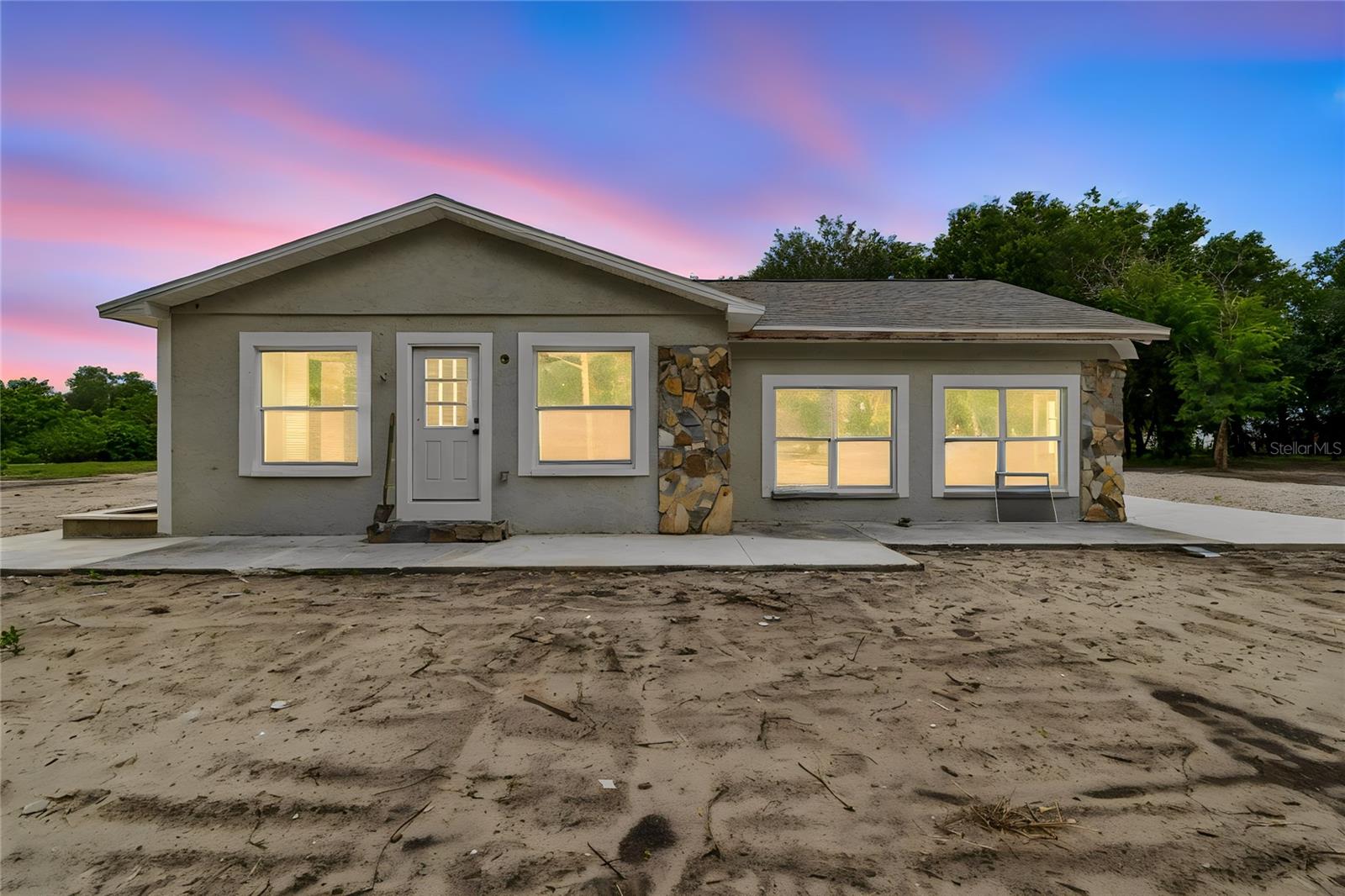 Stunning Fully Remodeled Estate on over 5 Acres in Carlton Lake! This beautifully renovated 3-bedroom, 3-bathroom residence offers over 2,000 square feet on an expansive 5-acre homesite, combining modern upgrades, privacy, and prime location. Every major component has been updated, including a brand-new roof, AC system, flooring, bathrooms, and a designer-inspired kitchen. Natural light pours throughout the home, highlighting the spacious layout and the inviting fireplace, which serves as the living area's centerpiece. Outside, you'll find three stables and endless possibilities for equestrian use, hobbies, or recreation. Positioned in the middle of the property, the home enjoys exceptional seclusion while remaining just minutes from upscale communities, shopping centers, restaurants, and everyday conveniences. This rare combination of acreage, upgrades, privacy, and location creates a truly exceptional lifestyle opportunity.