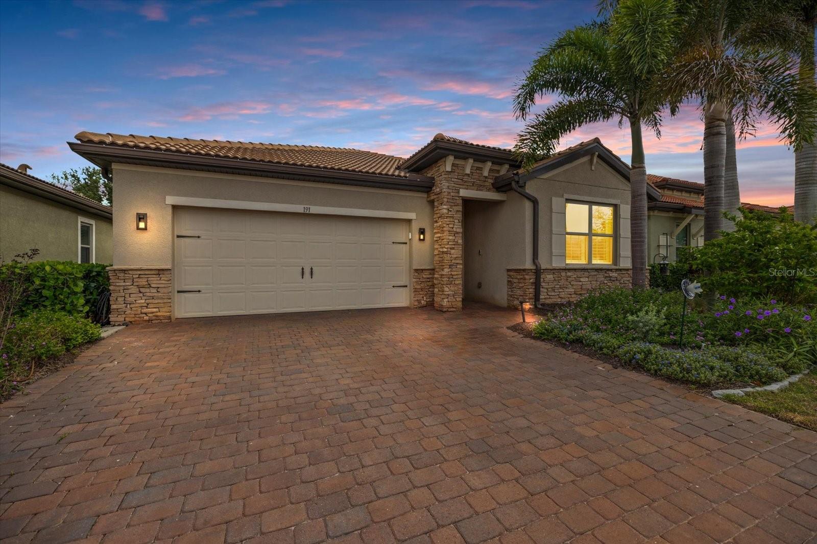 Welcome to 191 Maraviya Boulevard a beautiful home located in the highly desirable Toscana Isles community. This meticulously maintained residence offers the perfect blend of luxury, comfort, and Florida resort-style living. Featuring an open-concept floor plan with stylish upgrades throughout, this home is designed for both everyday living and entertaining.  
Interior upgrades include plantation shutters throughout, polished concrete floors, quartz kitchen countertops with custom backsplash and faucet, smart refrigerator, upgraded newer appliances, custom interior lighting and fans, floating media cabinet, matching built-in bar, and a beautifully remodeled laundry room with upgraded washer, dryer, and utility sink. The spacious primary suite features two custom closets and remodeled walk-in showers for a true spa-like feel.
Step outside to your private backyard oasis featuring a Superior Pools saltwater pool complete with remote-access app controls, sun shelf with fountain, spa, multi-color lighting, umbrella mount in the pavers, and screened cage enclosure — perfect for relaxing or entertaining year-round. Additional enhancements include a widened driveway and whole-home water filtration system.
Toscana Isles offers exceptional amenities including a resort-style clubhouse, infinity-edge pool, fitness center, pickleball, tennis courts, dog park, and scenic walking trails, all conveniently located near Nokomis Beach, Venice Island, dining, shopping, and the Legacy Trail.  Very close to Sarasota Memorial Hospital too.  This is Florida living at its finest. FEE of $1550.00 towards Capital Contribution
