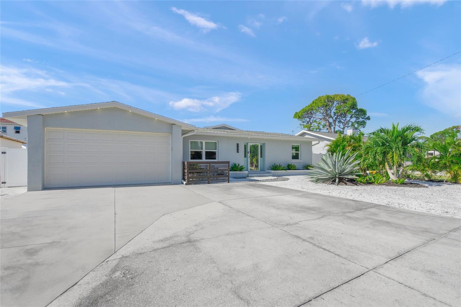 Stunningly Remodeled Home on Venice Island – No Flood Zone, No HOA!  This beautifully remodeled residence on the Island of Venice offers modern living in one of Florida’s most desirable coastal communities — all without HOA fees or flood zone concerns.  Completely renovated in 2018, this home features extensive updates, including: New roof, Storm-rated impact windows and doors, Updated plumbing and sewer lines, New electrical and HVAC systems, Custom cabinetry and modern lighting fixtures, Luxury vinyl plank (LVP) flooring throughout, New hot water heater, Expanded garage with impact-resistant door, Spacious indoor laundry room. The interior showcases a modern open-concept design, highlighted by a chef’s kitchen with a large breakfast bar and high-end finishes. The split floor plan provides privacy, featuring an incredible primary suite with direct access to the expansive backyard. The primary bath includes an oversized shower, dual vanities, and a generous walk-in closet. Two additional bedrooms offer abundant natural light and comfortable living space. The outdoor area is a true highlight, featuring two porches — one open and one with a 20x10 aluminum louvered pergola — plus a newer vinyl privacy fence and 8x8 TUFF SHED for extra storage. The oversized backyard provides plenty of room for a future pool, outdoor kitchen, or custom entertainment area. Located within walking distance to Venice Island’s charming restaurants, shops, Publix, and one block away from the Venetian Waterway Park, this home offers the perfect blend of convenience and coastal living. Enjoy a leisurely stroll to Historic Downtown Venice or the Venice Performing Arts Center, with Venice Beach just two miles away. This home sustained no hurricane damage and remains safely outside the flood zone — a rare find on the Island! Don’t miss this opportunity to experience the best of the Venice Island lifestyle.