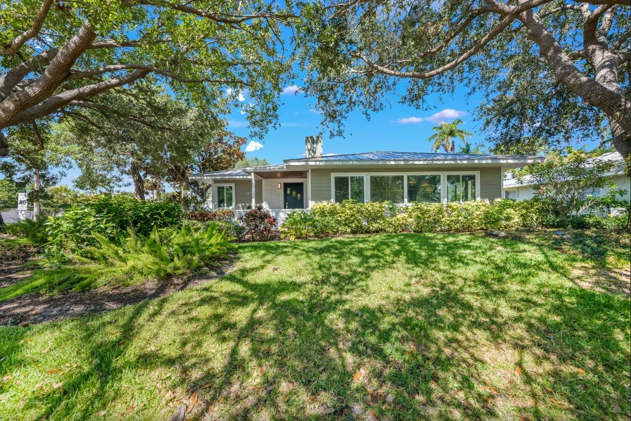 Welcome to an extraordinary opportunity on Lido Key, where refined coastal elegance meets exceptional investment potential. This beautifully appointed three-bedroom, two-bath pool home is being offered fully turnkey furnished and has an established history as a successful income-producing rental property, making it as smart as it is stunning.
Nestled beneath mature shade trees on an oversized 10,285 square foot lot, the property offers rare privacy just moments from the beach. Lush tropical landscaping surrounds the home, creating a serene island setting that feels worlds away while remaining close to everything that makes Lido Key so desirable.
Inside, soaring ceilings and expansive windows flood the home with natural light, enhancing the open-concept layout designed for effortless entertaining and everyday comfort. Warm wood floors, thoughtfully curated finishes, and a soft coastal palette create a relaxed yet sophisticated ambiance throughout. Every space feels intentional, welcoming, and ready to enjoy from day one.
The chef’s kitchen is a true centerpiece, featuring rich custom cabinetry, granite countertops, stainless steel appliances, double ovens, a wine fridge, and an extended breakfast bar perfect for hosting family and guests. The adjacent dining area opens seamlessly through sliding glass doors to the outdoor living space, blurring the lines between indoor comfort and Florida sunshine.
The spacious primary suite serves as a private retreat, complete with vaulted ceilings and a spa-inspired bath offering dual vanities, custom cabinetry, and a walk-in shower. Two additional guest bedrooms provide flexibility for visitors or vacation renters, while a full-size laundry area, built-in workspace, and generous storage add convenience to the home’s thoughtful design.
Step outside and discover your own private resort. The sparkling pool and expansive patio create the ultimate backdrop for entertaining, relaxing, and soaking in the year-round Florida lifestyle. Covered dining areas and multiple lounging spaces make this backyard oasis ideal for everything from quiet mornings with coffee to lively sunset gatherings.
Location is everything, and this home delivers. Just minutes from the pristine sands of Lido Beach and the iconic boutiques and dining of St. Armands Circle, you’ll enjoy immediate access to world-class shopping, waterfront restaurants, boating, and the vibrant arts and culture of downtown Sarasota. Lido Key continues to be one of the Gulf Coast’s most coveted destinations, prized for its laid-back luxury and strong vacation rental demand.
Whether you are searching for a sophisticated island residence, a luxury vacation retreat, or a high-performing investment property with proven income history, this exceptional Lido Key home offers the rare combination of lifestyle, location, and long-term value.
This is more than a home — it is the island dream realized.