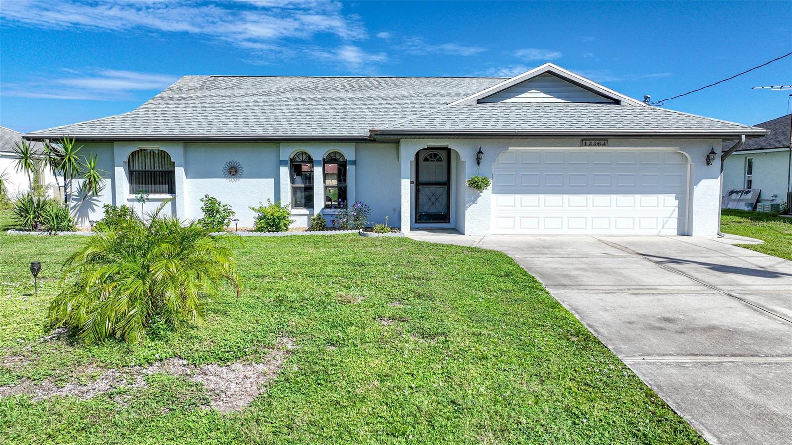 Welcome to your waterfront paradise in the charming Gulf Cove community! This well maintained, one owner, 2-bedroom, 2-bathroom, 2-car garage home offers the ultimate Florida lifestyle with a sparkling pool with a new cage, a boat dock, and a boat lift, all situated on a saltwater canal that leads you to open waters in just minutes. Boasting a new roof installed in 2022 and a brand-new AC system also installed in 2022 with 2 thermostats. This well-maintained gem offers worry-free living and investment potential. With just under 1400 square feet of living space, this residence features a thoughtfully designed split floor plan, providing ample privacy and functionality for residents and guests alike. Perfect for those seeking to downsize without sacrificing comfort or for savvy investors looking for lucrative short-term rental opportunities, this property offers both. The large lanai overlooking the pool is an ideal space for relaxation and entertaining, where you can soak in the Florida sunshine or unwind with a waterfront sunset backdrop. For water enthusiasts, this property offers the convenience of a private boat dock and boat lift right in your backyard, making it effortless to explore the enchanting waterways of the Gulf Cove area. Additionally, an inexpensive optional Property Owners Association membership, priced at just $65 per year.  A boat ramp sticker can be purchased for $65 along with the membership or stand alone,  for exclusive access to a private boat ramp and park, further enhancing your waterfront lifestyle. Don't miss out on the opportunity to make this Gulf Cove waterfront oasis your own. Whether you're looking for a tranquil retirement retreat or a savvy investment property, this home offers the best of both worlds. Schedule your showing today and start living the Florida dream!