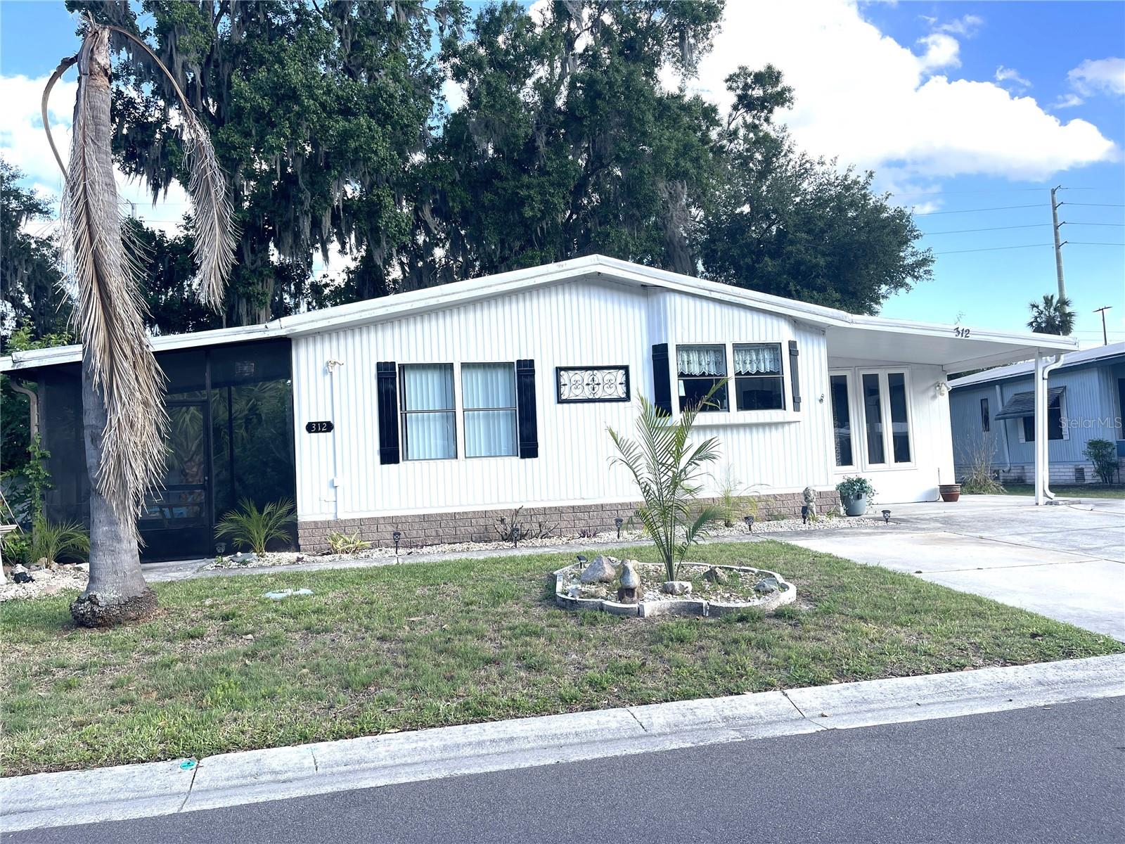 Owner displays excellent taste and decorating skills. New HVAC system just a couple months old. Some work to be done yet. Furnished and delightful. Plenty of extra parking and plush landscaping. Some work to be done, waiting on workers, all have full schedules. In the meantime enjoy our Championship 18 hole golf course or use our Olympic size heated pool. We offer numerous enjoyable things to do, wood working, 2 craft buildings, fitness center, library, restaurant and lounge, soft ball, driving range with practice green, billiards, plus so much more. Only 3 miles to Brownwood, The Villages. Central location, east and west an hour to the gulf or Atlantic, south 45 minutes to Orlando or 35 minutes north to Ocala. So much to do, you'll wonder why you didn't retire sooner.