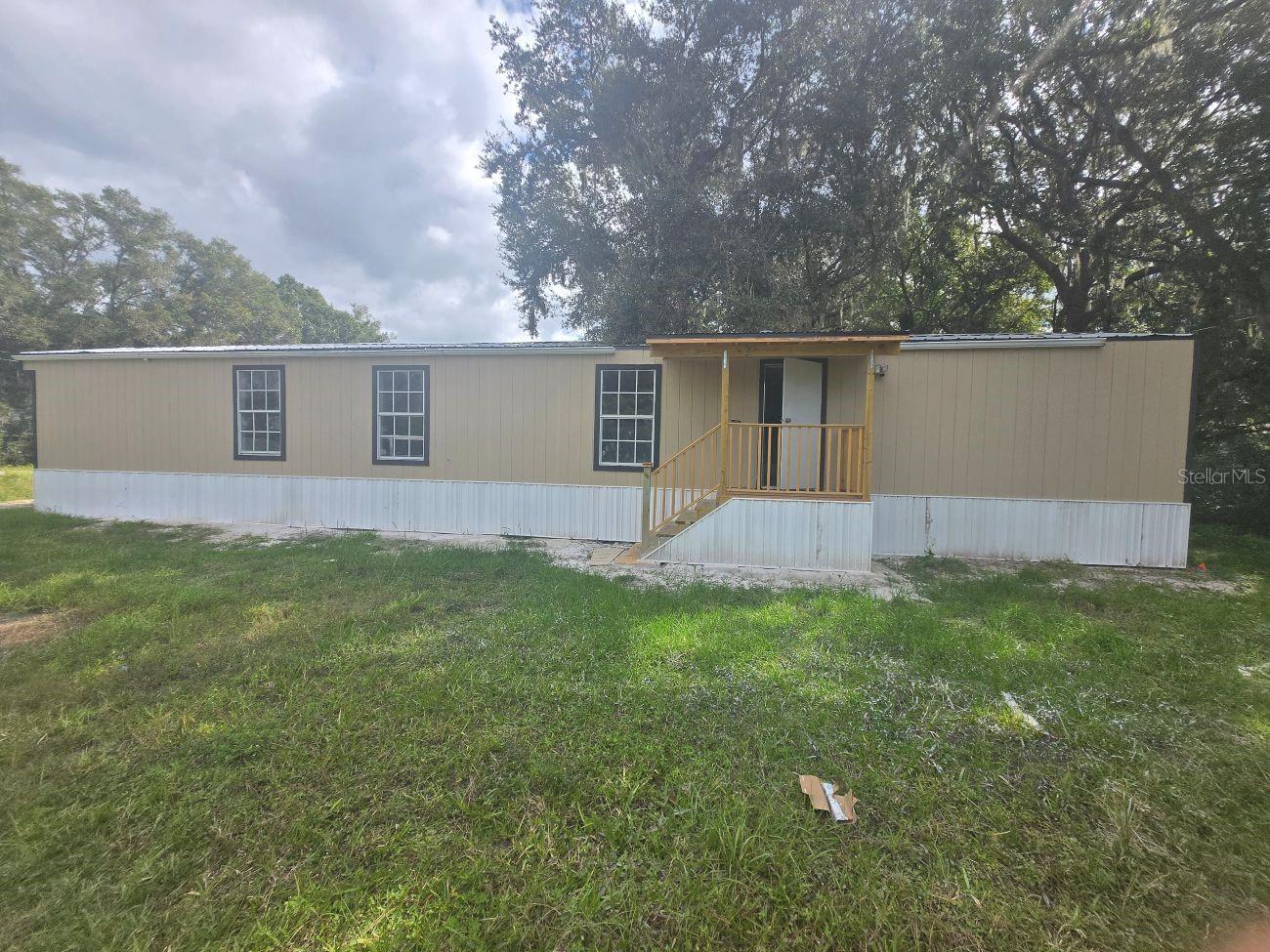 Fully remodeled 3-bedroom, 2-bath single wide mobile home built in 1989, offering 924 sq ft of comfortable living space. Situated on a desirable corner lot with NO HOA, this property features a brand new septic system, updated kitchen, new flooring, Enjoy outdoor living with a welcoming porch and spacious lot with added privacy. Conveniently located near Tenoroc High School and with easy access to Hwy 570, making commuting simple. Perfect opportunity for first-time homebuyers or investors looking for a move-in ready property with great potential.