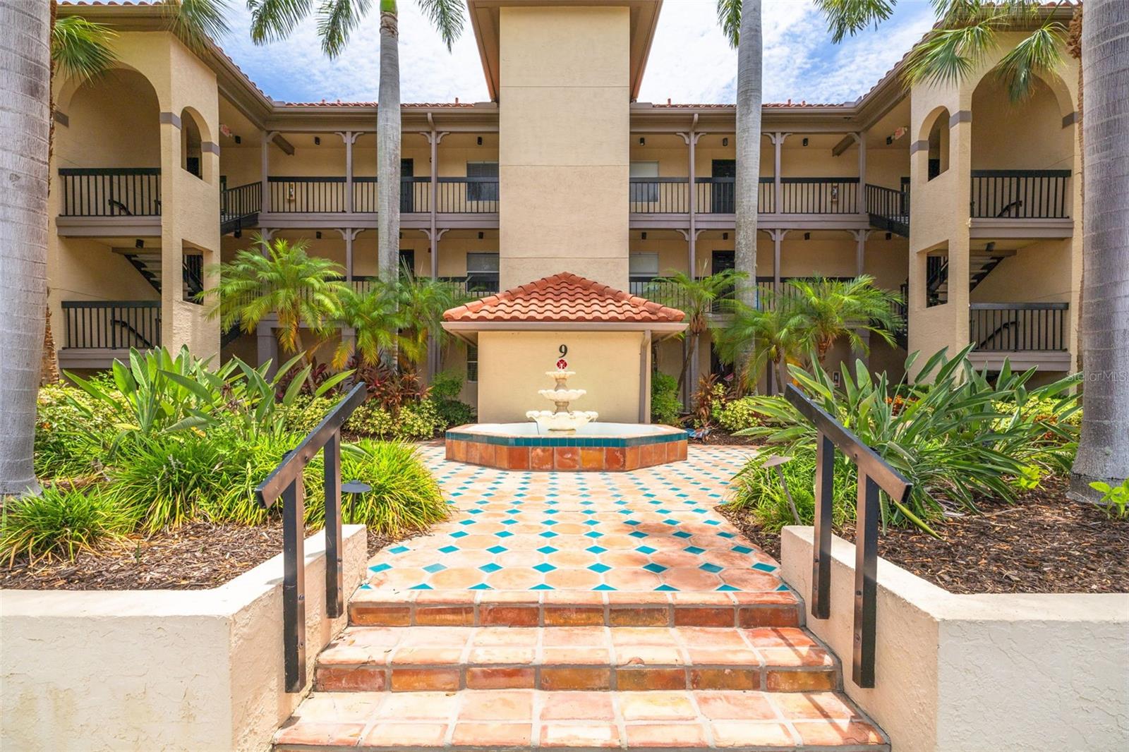 Virtually Staged. Resort-style living awaits in this desirable gated community, where an impressive collection of amenities creates the perfect Florida lifestyle. Residents enjoy a sparkling swimming pool, hot tub, sauna, fitness center, indoor basketball court, tennis courts, a clubhouse with a library and recreation room, and beautifully maintained grounds designed for both relaxation and recreation.

Conveniently located with a designated parking space directly in front, this inviting 2 bedroom, 2 bathroom condo offers an open floor plan that feels both comfortable and functional. The bright kitchen features white cabinetry, a stylish glass tile backsplash, stainless steel appliances, a large closet pantry, and a seamless flow into the dining area and living room, making everyday living and entertaining effortless. Tile flooring extends throughout the main living spaces, while rich wood-look luxury vinyl plank flooring adds warmth to the bedrooms. 

Both bedrooms offer walk-in closets and their own dedicated bathrooms, providing comfort and privacy for residents and guests alike. The spacious primary suite features an updated en suite bathroom with a large vanity, updated fixtures and attractive subway tiled shower. 

Unwind at the end of the day in the enclosed rear patio, where serene winding water and golf course views provide the perfect backdrop for your morning coffee or an evening of relaxation. Whether you prefer an active lifestyle or a peaceful retreat, this exceptional community offers something for everyone. Spend your days swimming, playing tennis or basketball, working out in the fitness center, unwinding in the sauna or hot tub, or gathering with neighbors at the clubhouse.

Beyond the community, you'll enjoy convenient access to Moccasin Lake Nature Park, nearby airports, professional sports venues, vibrant downtown St. Petersburg and Tampa, and the sugar-sand shores of Clearwater Beach. Surrounded by scenic nature trails, award-winning beaches, outstanding dining, shopping, and entertainment, as well as prestigious golf courses including Feather Sound Country Club, recent host of the PGA Tour, this home places the very best of the Tampa Bay lifestyle within easy reach.

Come experience the views, the amenities, and the lifestyle for yourself. You may just discover the place you'll love calling home!