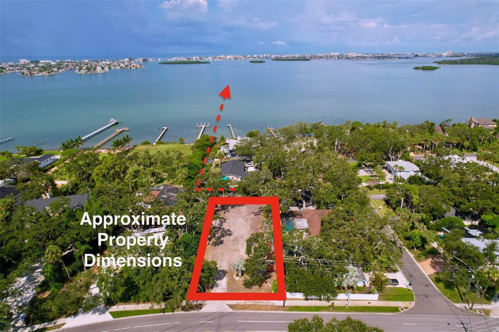 Build Your Dream Home on Prestigious Park Street
An exceptional opportunity awaits to own one of the last buildable lots on Park Street in St. Petersburg’s coveted Jungle Prada / Jungle Cove neighborhood. This oversized parcel has already been improved and is ready for new construction: the lot has been graded, temporary power is connected, and city water and sewer are installed and fully functioning. In addition, a private well provides running water, ideal for irrigation.

The property sits on higher ground, offering peace of mind and safety from flooding, and comes with a granted variance making it fully buildable. A complete set of architectural plans for a three-story luxury residence has already been submitted for permitting—giving a new owner the option to move forward quickly with construction, or start fresh with their own vision.

From the elevated living levels, you’ll enjoy breathtaking water views across Boca Ciega Bay, similar to those from neighboring estates, as confirmed by aerial photography. The property also backs onto the Reese Canal—perfect for kayaks and paddle boards—and is just one block from the public boat launch and the historic Tocobaga Indian village at Jungle Prada.

Surrounded by multi-million-dollar homes and shaded by mature oaks, this is a rare chance to create a signature estate in one of St. Petersburg’s most enchanting settings. You’ll be minutes by car or boat to Treasure Island, Madeira Beach, and downtown St. Pete, with shopping, dining, and parks all close by. This truly is your last chance at an extraordinary estate lot in Jungle Prada, where peacocks still roam and history meets luxury.