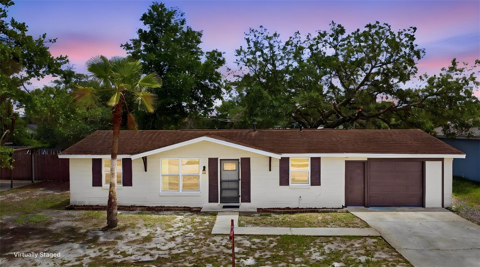 Virtually Staged. Welcome to this move-in ready 2-bedroom, 2-bath home located in the heart of Deltona, offering convenient access to Interstate 4 for easy commuting to Orlando, Sanford, and Daytona Beach. Recent updates include a BRAND-NEW gas water heater, updated electric panel, new carpet in the bedrooms, smart kitchen appliances, fresh interior paint all completed in 2026, and a BRAND-NEW ROOF to be installed prior to closing. The entire kitchen was remodeled in 2024.Updated vinyl windows throughout. Inside, the home features a desirable split floor plan designed for both comfort and privacy. The primary bedroom suite includes a walk-in closet with built-in storage for added convenience and a private bathroom. The cozy kitchen offers modern cabinets and gorgeous butcher block counters, stainless-steel appliances, a smart dishwasher and range, added for extra comfort. All kitchen appliances, along with the washer and dryer located in the  indoor laundry room, convey with the home. Step outside to enjoy the spacious fully fenced backyard, thoughtfully divided into two separate areas. One area offers a grassy space ideal for pets or outdoor play, while the paved enclosed area is perfect for BBQs, entertaining, or relaxing outdoors. The backyard also includes a 14x11 screened porch complete with a convenient doggy door. Public septic and water ensures no surprise septic tank or well replacements.  Ask your Realtor® for the unbranded virtual walking tour. All measurements are approximate and should be independently verified.