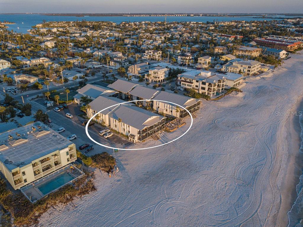 Experience true beachfront living in this rare Gulf-front condo on Anna Maria Island, perfectly positioned along the shoreline of Holmes Beach. This spacious 3-bedroom, 2-bath residence captures uninterrupted Gulf of Mexico views, daily sunsets, and instant access to the island’s iconic sugar-sand coastline. Homes with this setting, this vantage point, and this level of tranquility are exceptionally uncommon.
A double-door entry opens into a bright, airy interior where the water takes center stage. Oversized sliders frame the Gulf like moving artwork, filling the home with natural light and coastal breezes. Step onto your private covered balcony and take in panoramic views of turquoise water, passing dolphins, and vibrant evening skies—your personal front-row seat to one of Florida’s most beautiful vistas.
Designed for both relaxation and connection, the open-concept layout blends the kitchen, dining, and living areas into one seamless space—ideal for hosting guests or enjoying quiet mornings by the water. 
Set within a coveted boutique beachfront community, residents enjoy amenities rarely found on Anna Maria Island: a heated Gulf-front pool, sun deck, tennis court, tropical courtyard, and direct, private access to the beach. The intimate scale of the community creates a peaceful coastal atmosphere while still offering exceptional lifestyle perks.
Beyond the property, you are minutes from the best of Holmes Beach—local cafés, island dining, beachside shops, parks, and the free Anna Maria Island Trolley, which connects you effortlessly to Bean Point, Pine Avenue, the City Pier, and Bridge Street. Outdoor adventures, live entertainment, and miles of scenic bike paths are all within easy reach.
Whether you’re seeking a serene full-time residence, a seasonal escape, or a vacation property with strong guest appeal, this Gulf-front condo combines location, views, comfort, and convenience in a way that is nearly impossible to duplicate on the island. Here, every moment is shaped by the sound of waves, the glow of the sunset, and the ease of beachfront living.
Live where the shoreline becomes your backyard, the Gulf becomes your daily backdrop, and every day feels like a getaway—right here on Anna Maria Island.