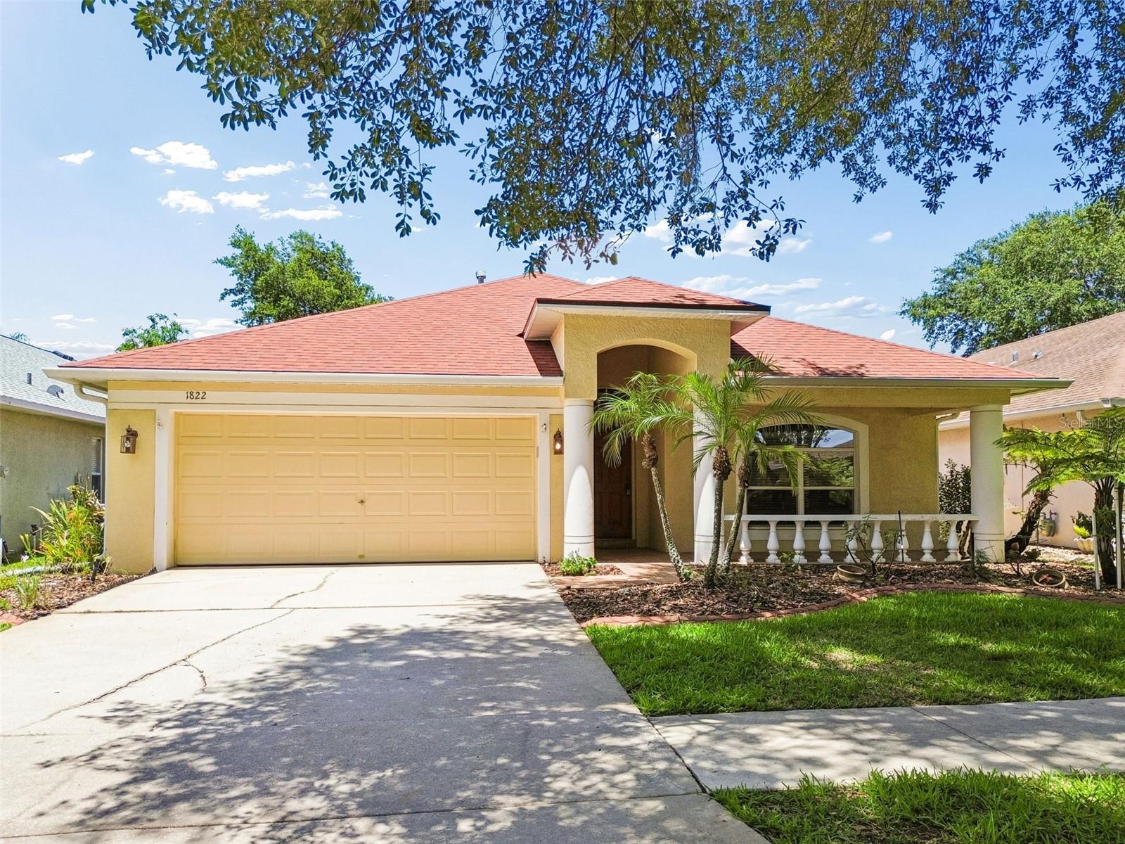 Set within the highly desirable Lumsden Pointe community of Valrico, Florida, this beautifully maintained 4 bedroom, 2 bathroom pool home offers the perfect blend of comfort, functionality, and move-in ready upgrades. Nestled on a quiet, tree-lined street with mature landscaping and excellent curb appeal, this home immediately stands out with its covered front porch, decorative concrete curbing, newer roof, newer AC system, and updated mechanicals that provide long-term peace of mind for today’s buyers. Inside, the spacious split-bedroom floor plan is designed for both everyday living and entertaining, featuring vaulted ceilings, fresh interior paint, abundant natural light, and multiple living and dining spaces that create flexibility for a variety of lifestyles. The open-concept kitchen overlooks the main living area and screened pool, making it ideal for hosting family and guests. The kitchen is equipped with stainless steel appliances, ample cabinetry, breakfast nook dining, bar seating, and additional space for a future center island if desired. A convenient interior laundry room is located just off the kitchen for added functionality. The privately positioned primary suite creates a true retreat with direct sliding glass door access to the outdoor living space, allowing for seamless indoor-outdoor Florida living. The spacious en suite bathroom features a walk-in closet, soaking tub, separate walk-in shower, and private water closet. Three additional bedrooms offer versatility for guests, a home office, nursery, hobby room, or growing family needs, with the fourth bedroom currently functioning as an office while still maintaining full bedroom capability with an existing closet. Step outside to your own private backyard oasis featuring a screened-in swimming pool, attached spa, expansive paver deck, covered lanai, and decorative fountain accents that create a peaceful resort-style atmosphere. Whether enjoying quiet evenings outdoors, entertaining guests, or spending weekends poolside, this outdoor living space is designed for year-round enjoyment. Conveniently located near top-rated schools, parks, shopping, dining, and major commuter routes, this Valrico pool home offers the upgraded features, functional layout, and Florida outdoor lifestyle buyers are actively searching for in today’s real estate market.(ROOF-2020)(A/C-2021)(W/H-2025)(Generator plug added for easy hook up)