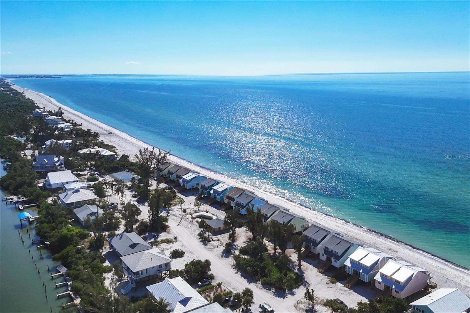 If you're looking for a 2 bedroom and 2.5 bath townhome directly on the Gulf of Mexico you've just found it here on Don Pedro Island.  It is in an association known as Colony Don Pedro Association 1, 2 and 3.  Amenities are swimming pool and dockage, both currently under repair as well as tennis courts.   Because of Hurricane Milton damage, the owner replaced all the decking under the unit as well as the stairs.  For convenience, it has a 1,000-pound capacity cargo lift to get your items from ground level to the first level of the unit.  This comes in extremely handy for day-to-day use.  You can simply step outside your front stairs to 7 miles of white sandy beaches and the Gulf of Mexico.  This being the least expensive townhome currently on the market the seller decided to let the new owner design and make it their own.