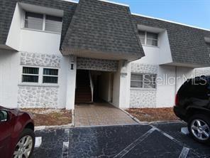 PRICE REDUCED: Holiday Oaks Condo, 2 Bedrooms, 1st Floor.  Huge Backyard. The County says this is a Non-Flood Zone, (X), No Rear Neighbor, Washer & Dryer 10 steps from the front door. Nearby local shopping area such as Home Depot, Publix, Super Market, Whole Foods etc.  Less than 44 minutes to St. Pete Beach.  Great Location and Great Income producing property for investors OR Primary Residence.  There is a tenant in place monthly $1300.00 - however, the lease expires the 2nd week of August 2026.