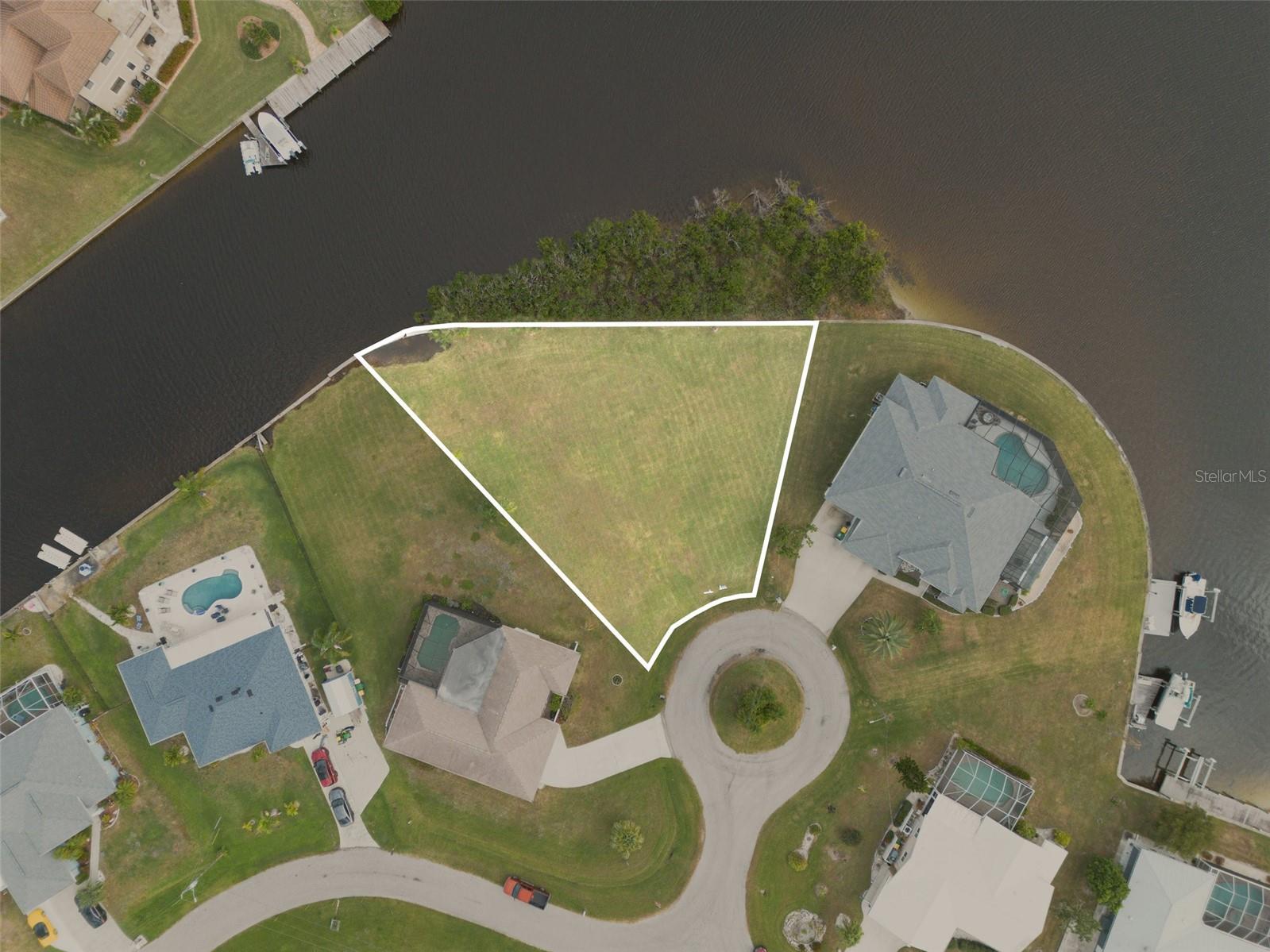 Builder-Ready Waterfront Lot in Prime Port Charlotte Location with High-Growth Opportunity. Over 200 feet of water-frontage.
Survey available. Fantastic opportunity for builders, or bring your own builder.
Discover a rare opportunity to secure a build-ready waterfront parcel in Port Charlotte, a high-growth, desirable market with tremendous upside. This exceptional lot offers direct access to the Gulf of Mexico through the Myakka River making it a perfect canvas for your custom dream home or investment property. Nestled in a stable and expanding community, the setting combines peaceful waterside living with convenient access to local amenities, shopping, dining, and recreation. With your vision and the right design, this lot can deliver waterfront lifestyle and long-term value. Don’t miss your chance parcels like this don’t come along often.