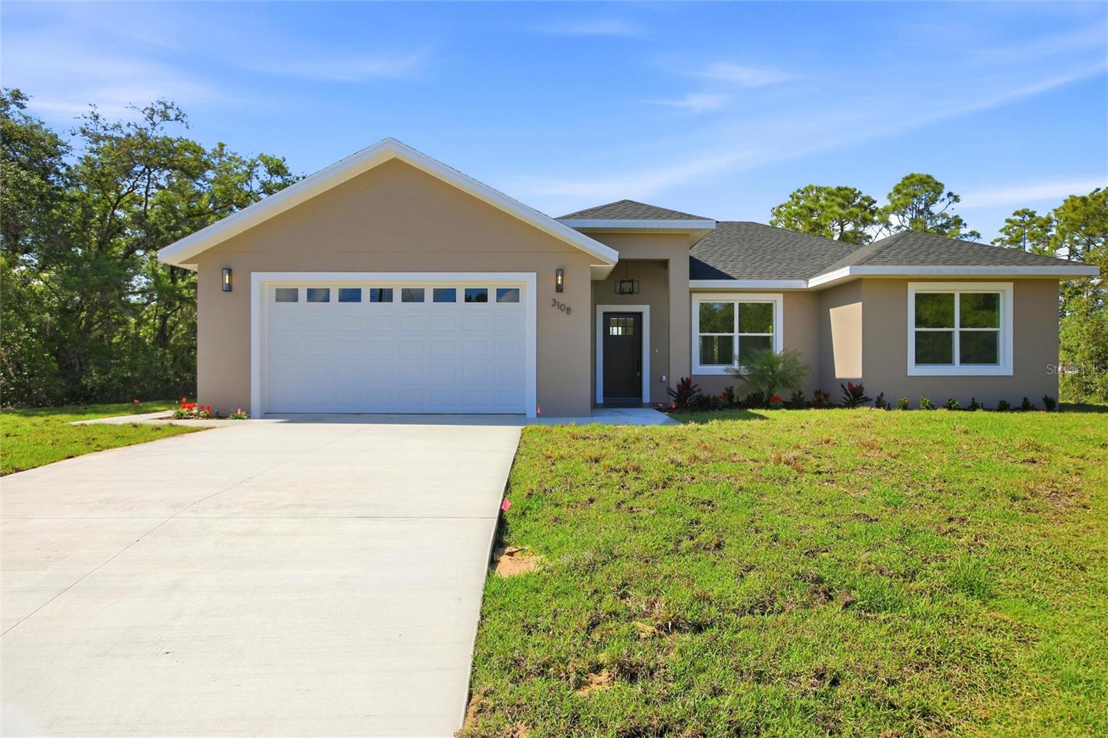 Brand-New Construction in Lake Placid | Move-In Ready + Modern Living!

Welcome to your brand-new 3-bedroom, 2-bath home in the desirable Sebring Country Estates—where modern design meets comfort, space, and functionality.

Step inside to a bright, open-concept layout with a thoughtfully designed split floor plan, perfect for both everyday living and entertaining. The heart of the home is the stylish kitchen, featuring stainless steel appliances, abundant cabinetry, and seamless flow into the living and dining areas—ideal for hosting or relaxing at home.

The private primary suite offers a peaceful retreat with an en-suite bath, while the additional bedrooms are positioned for privacy—perfect for family, guests, or even a home office.

Enjoy low-maintenance wood-look laminate flooring, modern finishes, and ceiling fans throughout, giving the home a clean, contemporary, move-in ready feel.

Step outside to your covered patio, where you can unwind or entertain year-round while enjoying Florida’s beautiful weather. The spacious backyard offers endless possibilities—add a pool, create a garden, or design your own outdoor oasis.
Additional highlights include a 2-car garage with ample storage and a convenient indoor laundry area.
 Located in a growing area with room to expand and invest, this home is perfect for buyers looking for new construction, modern finishes, and long-term value.
 Don’t miss your opportunity to own a brand-new home in Lake Placid—schedule your showing today!