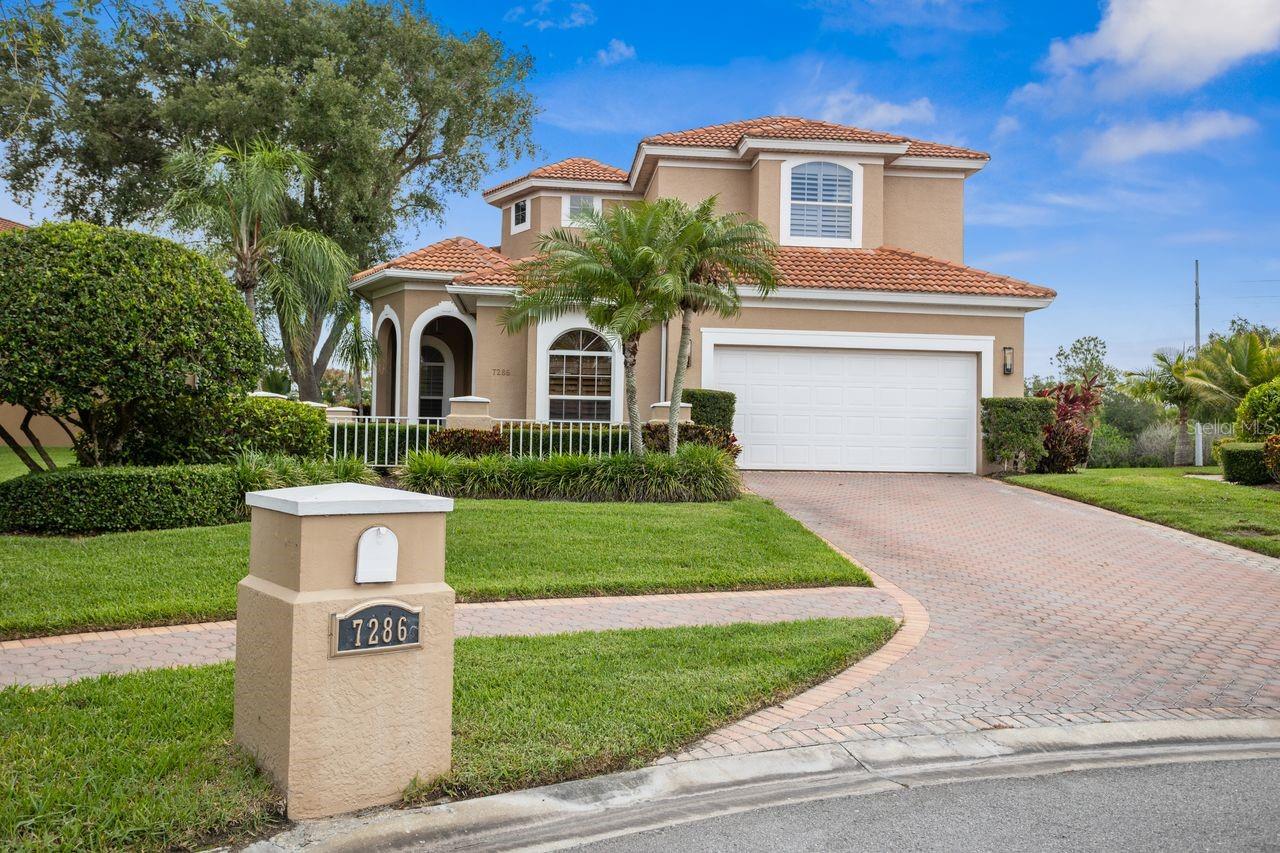 Welcome to the epitome of luxury living in prestigious Bayou Club Estates on Maidencane Court. This stunning 4 bedroom, 2 1/2 bathroom home sits gracefully on a premiere, cul-de-sac, oversized lot on a Tom Fazio signature championship golf course, offering breathtaking views and a tranquil setting. Upon entering the home, you are greeted by cathedral high rotunda and high ceilings throughout the home. The double entry into the primary bedroom on the first floor provides added privacy and convenience. The gourmet kitchen is a chef's dream, featuring granite countertops, breakfast nook, real wood cabinets high-end stainless-steel appliances, and a center island for prep work and casual dining also enjoy a gas fireplace in the great room. The open floor plan flows seamlessly into the spacious living and dining areas, making it perfect for entertaining guests or enjoying family time. Crown molding and plantation shutters add an elegant touch to every room, while the large indoor laundry room with cabinets and a sink for your convenience and bonus room upstairs provide additional convenience and storage options. The primary bedroom features a lavish ensuite bathroom with a soaking tub and walk-in shower for a spa-like experience. Step out back to the screened porch situated between holes #2 & #3 and on a tranquil pond, perfect for al fresco dining or relaxing in the Florida sunshine. This home is truly a rare find in one of the most sought-after communities in the area. The Bayou Club is a 24-hour security gated community, offering peace of mind and exclusive amenities. Don't miss your chance to own this exquisite masterpiece in Bayou Club Estates. Experience unparalleled luxury and comfort in this stunning home.