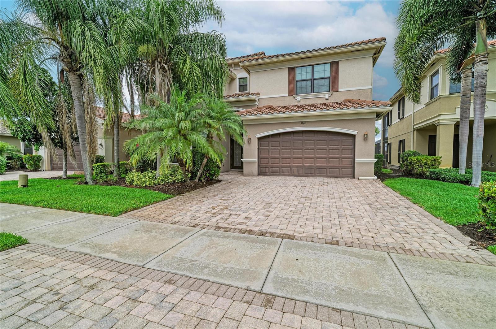 Experience luxury lakefront living in one of Naples’ premier gated communities, where resort-style amenities and elegant design come together in this expansive 5-bedroom, 5-bathroom estate. Perfectly positioned on a scenic lakefront homesite with tranquil water and natural preserve views, this beautifully appointed residence offers exceptional indoor and outdoor living spaces designed for entertaining and everyday comfort.

Step inside to discover a dramatic two-story great room filled with natural light, seamlessly connected to the gourmet chef’s kitchen featuring granite countertops, custom cabinetry, high-end appliances, abundant storage, and an open-concept layout overlooking the spacious family room and stunning wall of windows and sliders leading to the outdoor oasis. A formal dining room creates the perfect setting for hosting guests, while the main level also features a private guest suite and full pool bath for convenience.

Upstairs, enjoy a thoughtfully designed split-bedroom floor plan with an additional coffee bar/lounge area, two spacious guest suites, and a luxurious primary retreat offering breathtaking lake views, dual vanities, dual water closets, oversized walk-in closets, and a spa-inspired atmosphere.

Outdoor living shines with an oversized heated pool, expansive covered lanai, and plumbing already stubbed for a future summer kitchen, creating the ideal space to embrace the Southwest Florida lifestyle year-round.

Additional luxury upgrades include 2 brand new A/C units (installed June 2026), crown molding, fresh interior paint, updated landscaping, newer appliances, designer finishes, and more. Residents enjoy access to outstanding community amenities including resort-style pools, dining, tennis courts, pickleball, walking and biking trails, a state-of-the-art fitness center, recreational areas, and an active social lifestyle in one of Naples’ most sought-after established communities.

Luxury, space, location, and lifestyle — all competitively priced and ready for new owners to enjoy.