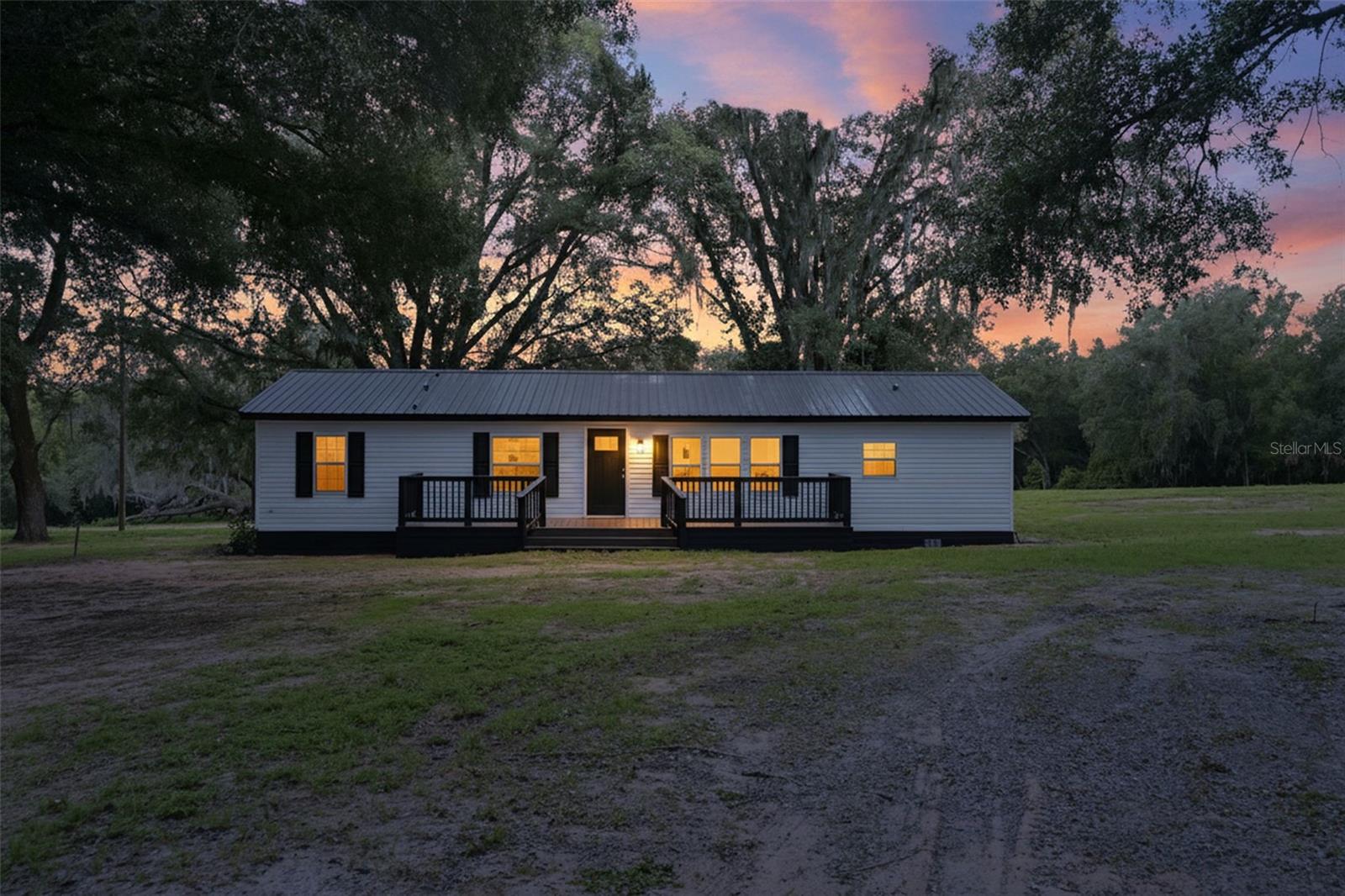 Escape to the peace and privacy of country living with this beautifully remodeled 3- bedroom, 2- bath manufactured home nestled on 10 picturesque acres in rural Brooksville, FL. Thoughtfully updated from top to bottom, this move-in-ready home offers the perfect blend of modern comfort and wide-open space. 

No detail was overlooked in this total renovation, featuring a brand-new metal roof, new windows and doors, new HVAC/AC system, new tankless water heater, new laminate flooring throughout, all new beautifully designed primary bathroom and hall bath. Brand new kitchen cabinets along with all new LG stainless steel appliances. A brand-new gorgeous porcelain electric fireplace. The entire home has been freshly painted inside and out. New front and back decks spacious enough for all your entertaining purposes. 

Outside, enjoy endless possibilities across the 10 acres of rural land. Ideal for animals, gardening, recreational vehicles, farming or simply enjoying the privacy of the natural beauty of Brooksville, Florida. Whether you're looking for a homestead or a peaceful full-time residence, this property delivers room to roam and freedom to live the lifestyle you've been dreaming of.