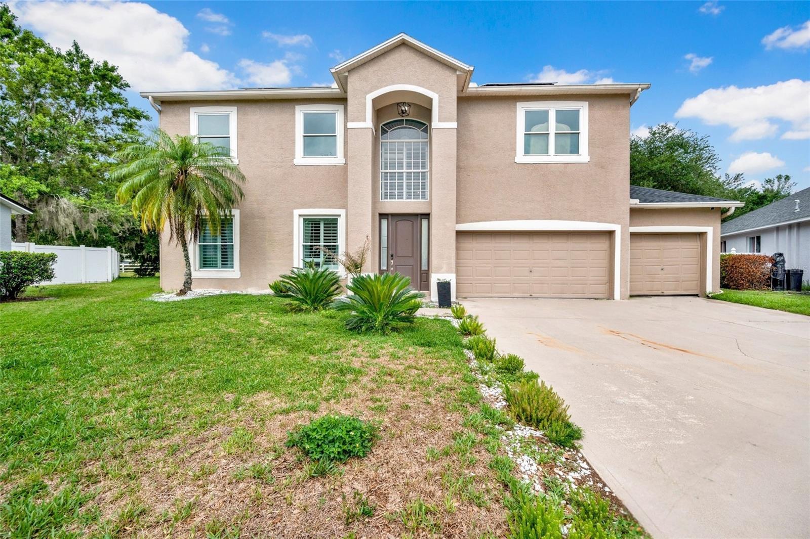 Welcome to this exceptional five-bedroom, three-bathroom home located in a desirable gated community on a quiet cul-de-sac at 3103 Ashmonte Drive in Land o lake. Backing to peaceful conservation views, this beautifully maintained property offers the perfect blend of privacy, luxury, and functionality.

Step inside to discover spacious living areas, including two separate dining areas and an oversized family room featuring elegant French doors that open to the outdoor living space. The chef’s kitchen is equipped with stainless steel appliances, ample cabinetry, and an ideal layout for entertaining. A convenient first-floor guest bedroom and full pool bath provide flexibility for visitors or multigenerational living. The roof was replaced approximately one year ago.

Upstairs, you’ll find generously sized bedrooms along with a versatile bonus room perfect for a media room, home office, or playroom. Plantation shutters throughout the front of the home add timeless style and curb appeal.

Outside, enjoy Florida living at its finest with a private screened pool and hot tub overlooking serene conservation land. Additional highlights include. solar panels that are financed separately and are not included in the mortgage or purchase price. Buyers may choose to assume the remaining balance and terms of the solar loan, subject to lender approval. If the buyer elects not to assume the solar agreement, the seller will have the solar panels removed from the property prior to closing.
Residents of this sought-after community also enjoy access to outstanding amenities including a community pool, fitness center, playground, and more.
This home combines comfort, elegance, and resort-style living in one incredible package. The home is being offered furnished. Furnishings are available for purchase separately and are not included in the listing price. Any sale of furniture and personal property shall be negotiated under a separate agreement between buyer and seller.