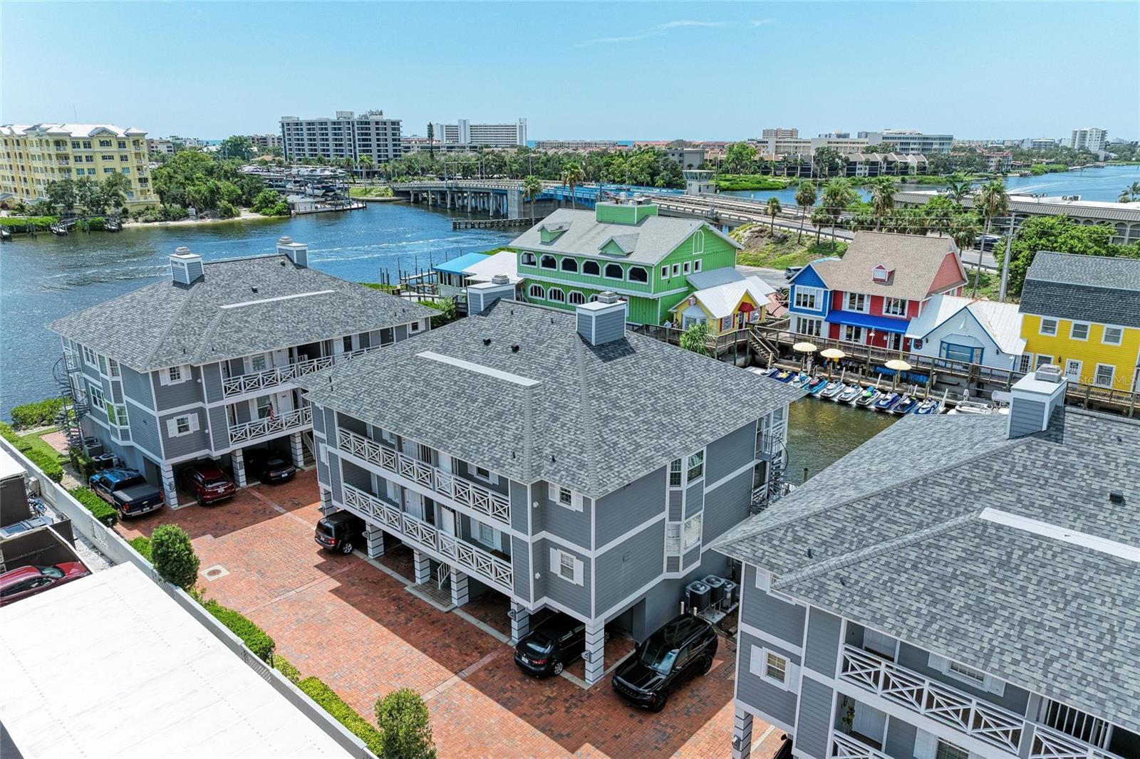 The Boatyard is a New England styled gated community of twenty one units located on the Intracoastal Waterway just across the south bridge from Siesta Key and its number one rated beach.  Nearby are numerous opportunities for the shopping, dining, sports, and cultural activies that Sarasota is famous for.  This furnished two bedroom, two bath unit features water views from most rooms, a bright open concept living/dining room with a tray ceiling and wood burning fireplace, an enclosed balcony overlooking a canal, updated kitchen and bathrooms, an oversized one car garage, and a ground level bonus room off the canal.  In addition, the community amenities include a sundeck on the intracoastal waterway, a boardwalk along the canal, and a heated swimming pool.  This is the Florida lifestyle you've been looking for.