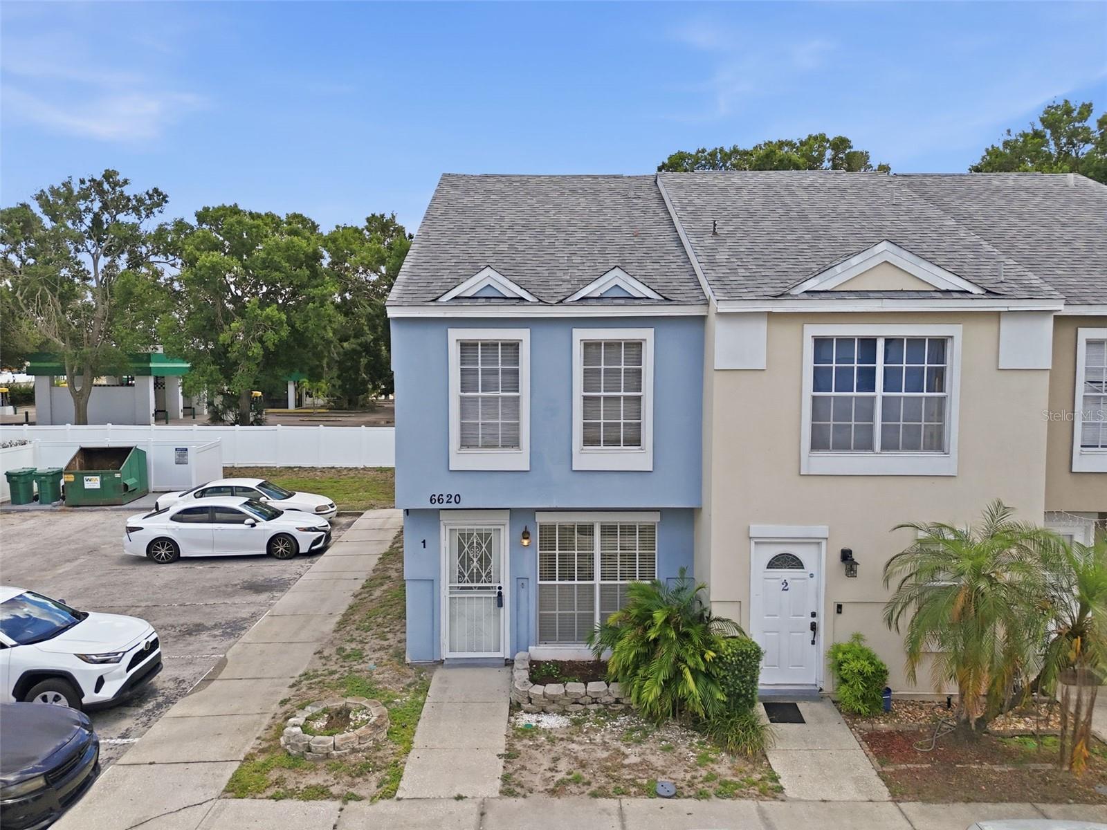 Welcome to this charming two-bedroom, two-and-a-half-bathroom end-unit townhome in Largo, offering a 2018 roof and a functional layout with a convenient location close to beaches, dining, and everyday amenities. With added privacy as an end unit, and in a non-flood zone, this condo is perfect for year-round living, a seasonal getaway, or an investment opportunity. Step inside to a bright and inviting front living room filled with natural light. The open dining room and kitchen combination provides a seamless flow for entertaining and everyday living. The kitchen features matching light appliances, a breakfast bar for casual dining, and easy access to the washer and dryer closet, conveniently located just off the kitchen. A half bathroom downstairs adds extra convenience for guests. Upstairs, both bedrooms offer high ceilings, ceiling fans, and comfortable layouts. The spacious primary bedroom includes two closets and a private en-suite bathroom for added comfort and privacy. The second bedroom features direct access to the shared bathroom from inside the room, creating a flexible and functional setup. Additional highlights include an assigned parking space and a location that places you just about 20 minutes from Indian Rocks Beach, where you can enjoy beautiful Gulf Coast sunsets, sandy beaches, and waterfront dining. Conveniently close to local restaurants, shopping, and entertainment, this townhome offers the ideal blend of comfort, convenience, and Florida lifestyle living. Schedule your showing today!