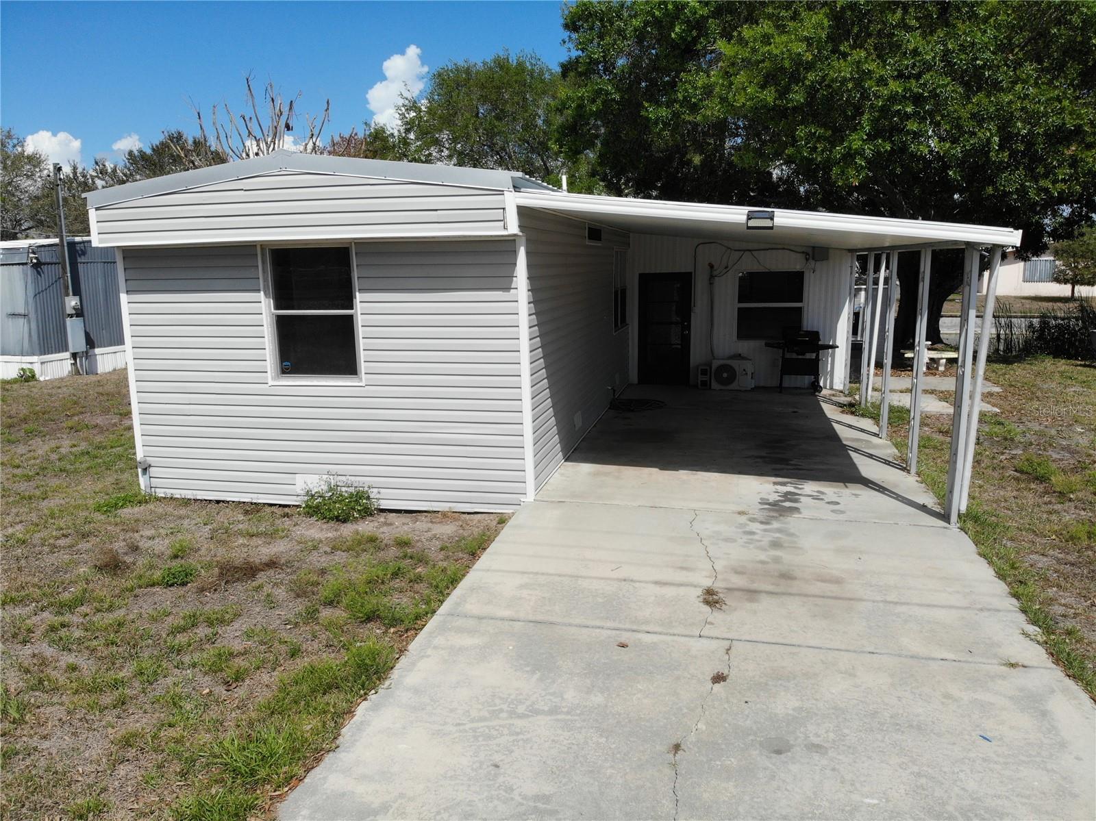 Fisherman’s paradise in Buckhead Ridge — this updated 2-bed, 2-bath canal-front home sits on a lush, tropical waterway that leads directly into Lake Okeechobee. Enjoy effortless days on the water with your private boat ramp and a fish-cleaning station right at the edge of the canal. Inside, fresh paint and a fully enclosed patio with a new mini-split system offer a cool, comfortable retreat after a day outside. Set on a peaceful dead-end street with Publix, restaurants, and everyday shopping just minutes away — and best of all, no HOA.