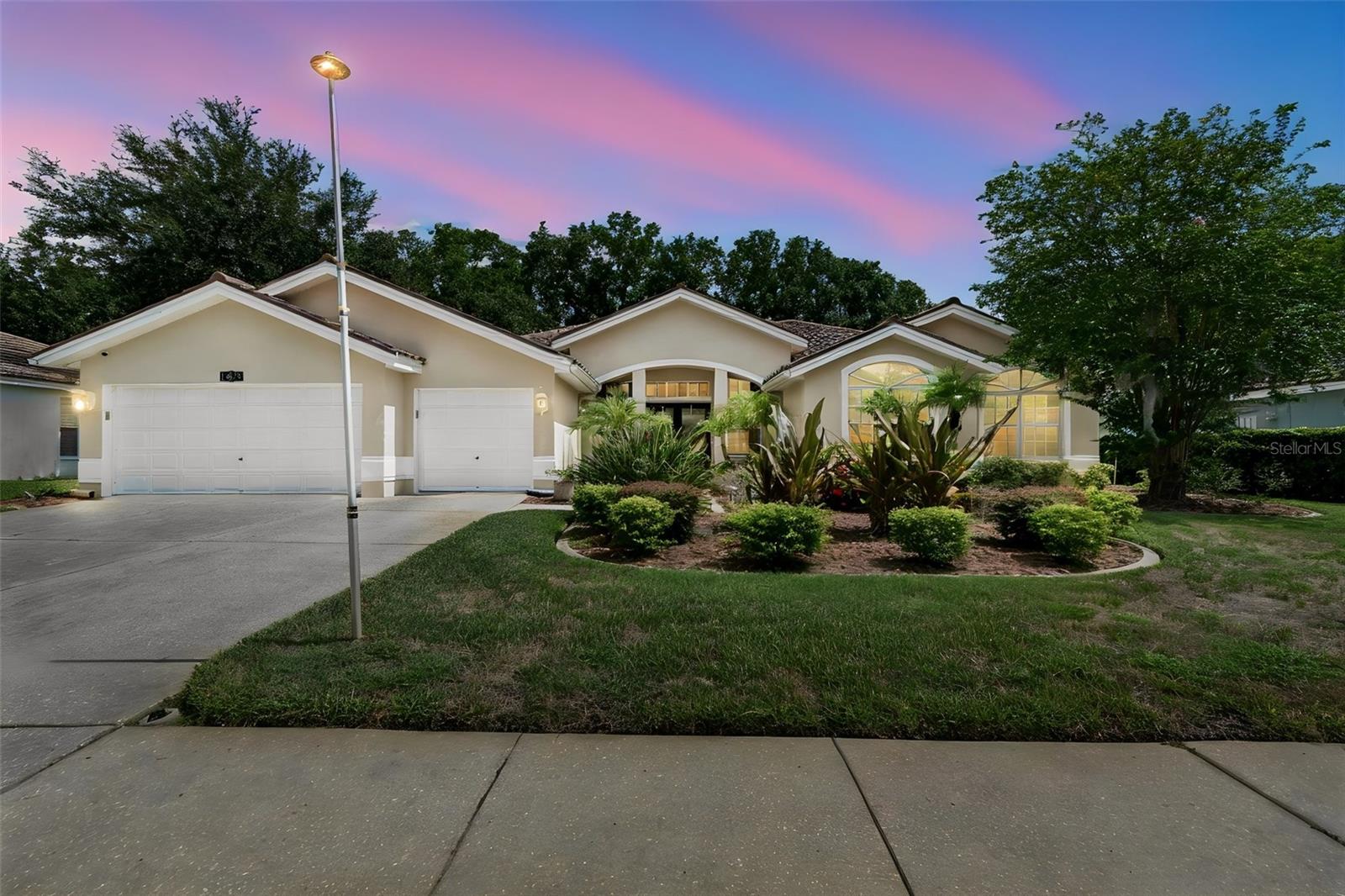 Virtually Staged. Resort-style living awaits in this stunning 3-bedroom plus office, 3-bath POOL home with a 3-car garage located in the gated Crescent Oaks Country Club community! Overlooking the 14th hole, this property offers beautiful golf course views and an outdoor space designed for year-round enjoyment. Step through the impressive custom made stain glass double-door entry and immediately take in views of the sparkling screened pool and expansive lanai. The thoughtfully designed floor plan provides comfortable living and entertaining spaces, highlighted by a spacious kitchen featuring granite countertops, stainless steel appliances, a glass-top range, a built-in desk area, and a generous breakfast bar. The private primary suite serves as a relaxing retreat with a custom walk-in closet and an en-suite bath complete with dual vanities, granite countertops, a soaking tub, and an impressive glass-enclosed shower with newly installed shower doors. A split-bedroom layout offers added privacy, with two guest bedrooms sharing a well-appointed bath featuring dual sinks and granite countertops. The dedicated office includes built-in shelving and offers flexibility for a home workspace, library, or potential fourth bedroom. A third full bath provides direct access to the lanai and pool area, making outdoor entertaining effortless. The true centerpiece of the home is the screened outdoor living space, where the pool, golf course views, and two covered seating areas create the perfect setting for relaxing, dining, or hosting guests. Additional updates include an energy-efficient HVAC system installed in 2023. Conveniently located near shopping, dining, parks, trails, beaches, and top-rated schools, this home delivers the lifestyle you've been looking for. Schedule your private showing today!