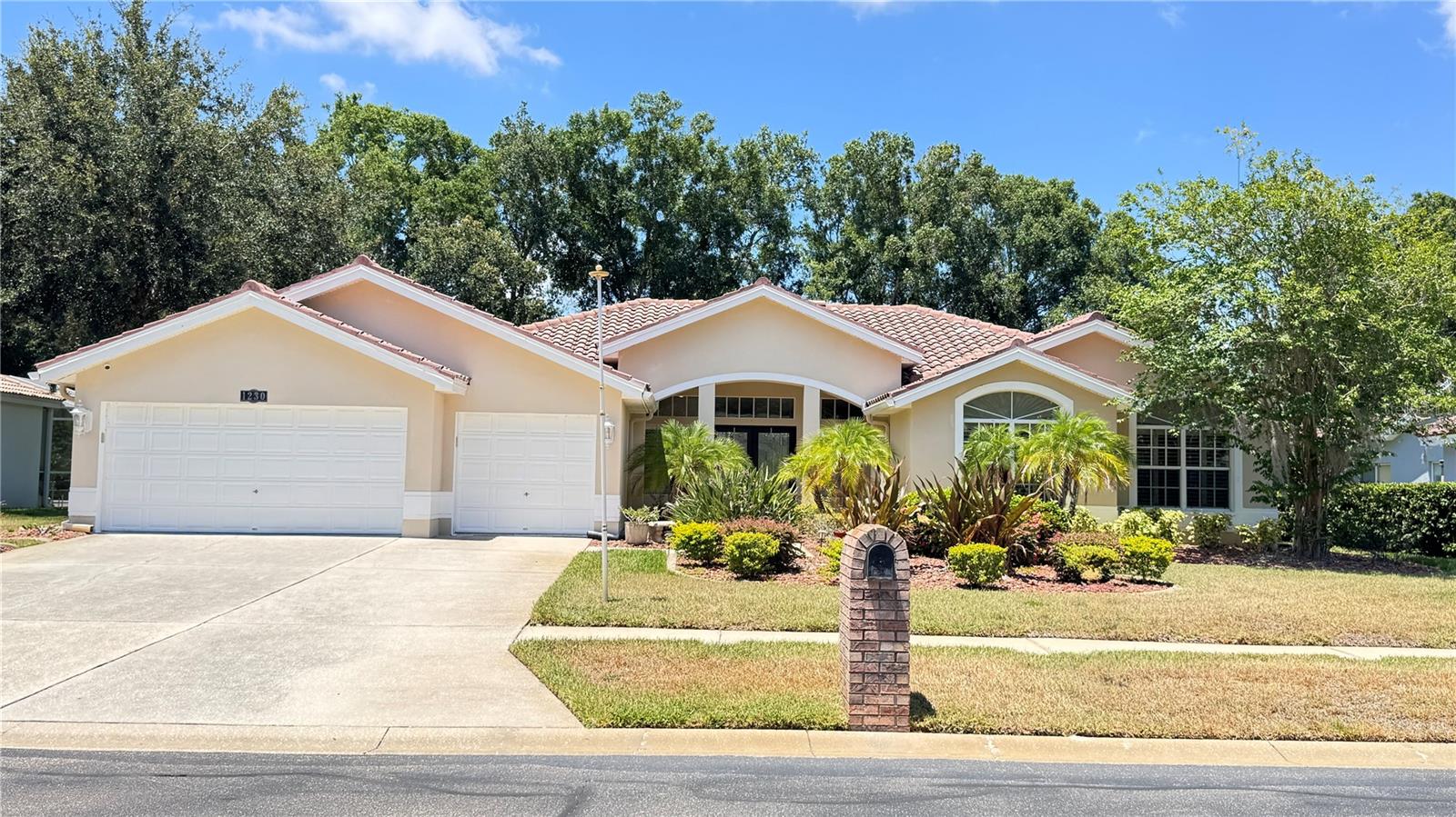 Resort-style living awaits in this stunning 3-bedroom plus office, 2-bath POOL home with a 3-car garage located in the gated Crescent Oaks Country Club community! Overlooking the 14th hole, this property offers beautiful golf course views and an outdoor space designed for year-round enjoyment. Step through the impressive custom made stain glass double-door entry and immediately take in views of the sparkling screened pool and expansive lanai. The thoughtfully designed floor plan provides comfortable living and entertaining spaces, highlighted by a spacious kitchen featuring granite countertops, stainless steel appliances, a glass-top range, a built-in desk area, and a generous breakfast bar. The private primary suite serves as a relaxing retreat with a custom walk-in closet and an en-suite bath complete with dual vanities, granite countertops, a soaking tub, and an impressive glass-enclosed shower with newly installed shower doors. A split-bedroom layout offers added privacy, with two guest bedrooms sharing a well-appointed bath featuring dual sinks and granite countertops. The dedicated office includes built-in shelving and offers flexibility for a home workspace, library, or potential fourth bedroom. A third full bath provides direct access to the lanai and pool area, making outdoor entertaining effortless. The true centerpiece of the home is the screened outdoor living space, where the pool, golf course views, and two covered seating areas create the perfect setting for relaxing, dining, or hosting guests. Additional updates include an energy-efficient HVAC system installed in 2023. Conveniently located near shopping, dining, parks, trails, beaches, and top-rated schools, this home delivers the lifestyle you've been looking for. Schedule your private showing today!