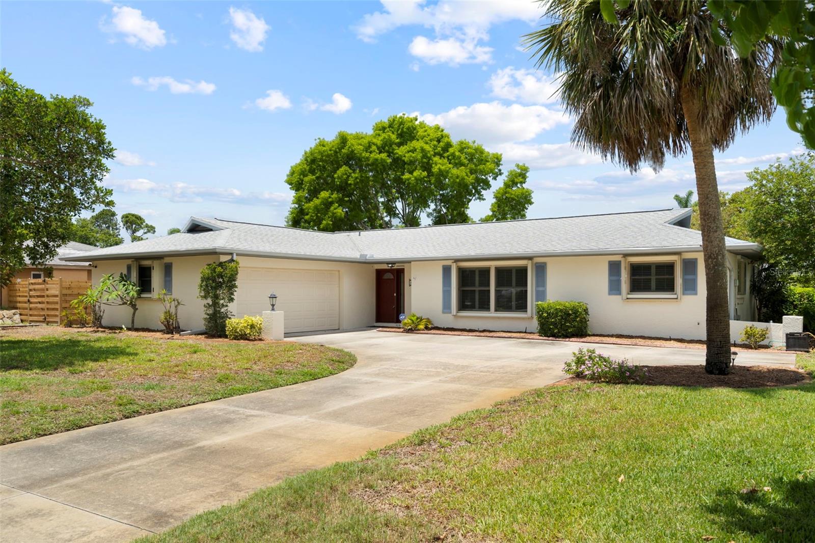 Welcome to this beautifully maintained 3-bedroom, 2-bathroom home with a 2-car garage in the highly desirable neighborhood of The Crossings. Ideally located in West Bradenton, you'll enjoy convenient access to shopping, dining, medical facilities, recreation, and the stunning beaches of Anna Maria Island. Designed with both comfort and functionality in mind, the home features a welcoming entry that opens to a formal living and dining area. The updated kitchen boasts all-wood cabinetry, abundant counter space, and an extended countertop perfect for entertaining. It flows seamlessly into the spacious family room, creating an ideal gathering space. The generously sized primary suite offers an updated closet system and a private ensuite bath. Bedrooms two and three are also oversized, providing flexibility for family and guests.  Additional updates include plantation shutters, laminate flooring, impact windows throughout, and exterior accordion hurricane shutters for added peace of mind. Other highlights include an enclosed lanai perfect for morning coffee, an outdoor patio for birdwatching, and a fenced backyard offering privacy. Major updates include a new irrigation well pump (May 2026), HVAC system (2024), roof (2021), and water heater (2020). Outdoor enthusiasts will appreciate the home's proximity to G.T. Bray Park, offering sports fields, a dog park, aquatic center, tennis and pickleball courts, playgrounds, and more. This home combines modern updates, exceptional protection, and an unbeatable location—without the burden of HOA fees. Don't miss this opportunity to own a piece of West Bradenton living at its best!